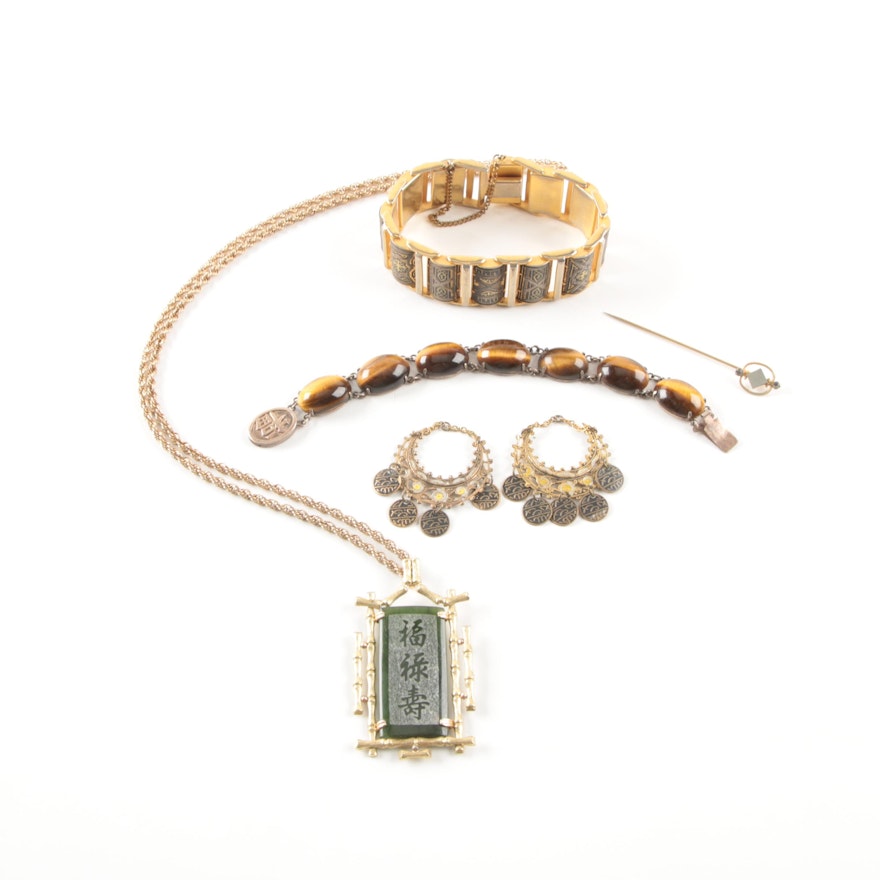 Collection of Gold Toned Jewelry Including a Silver Bracelet