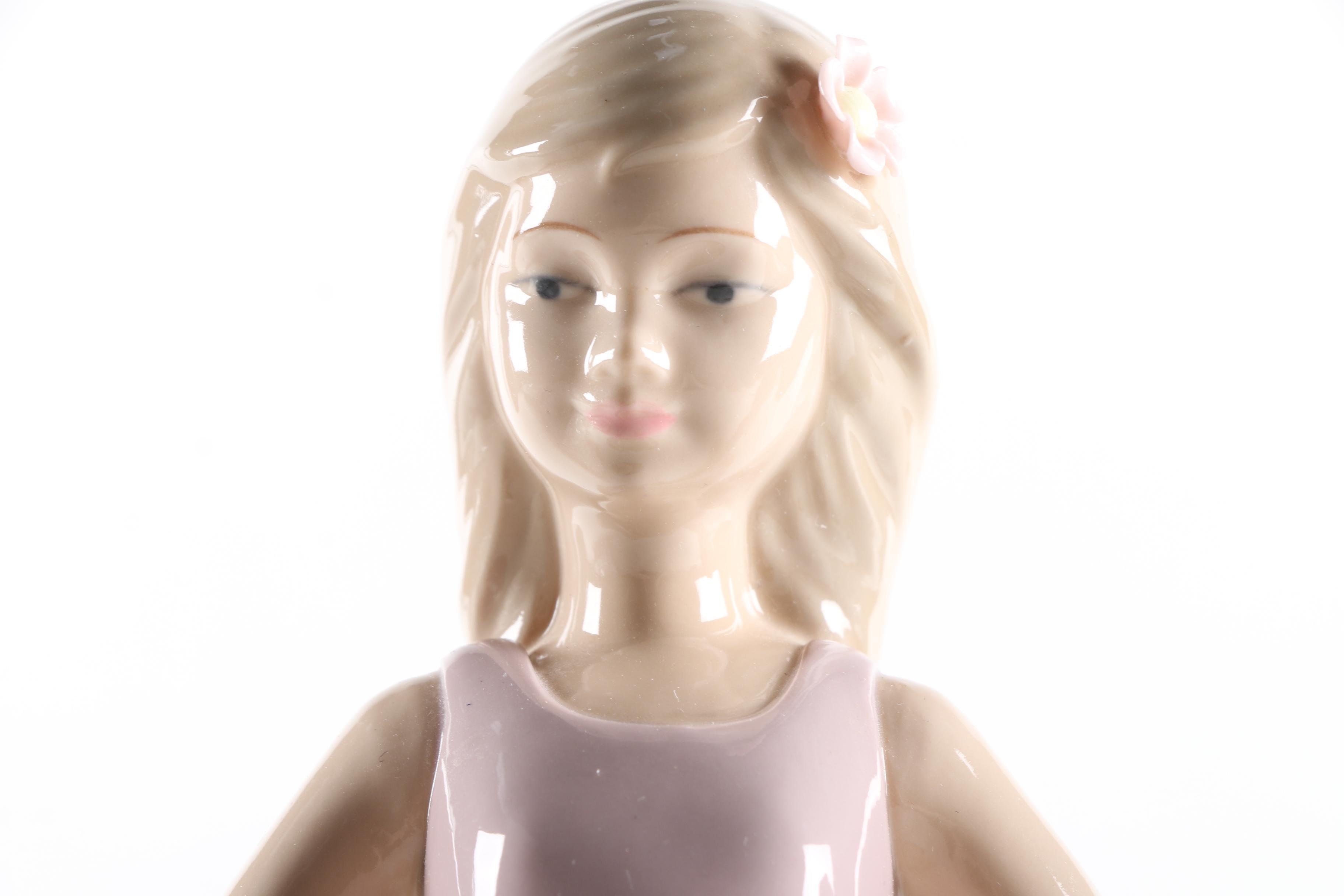 Porcelain Figurines of a Boy and Girl