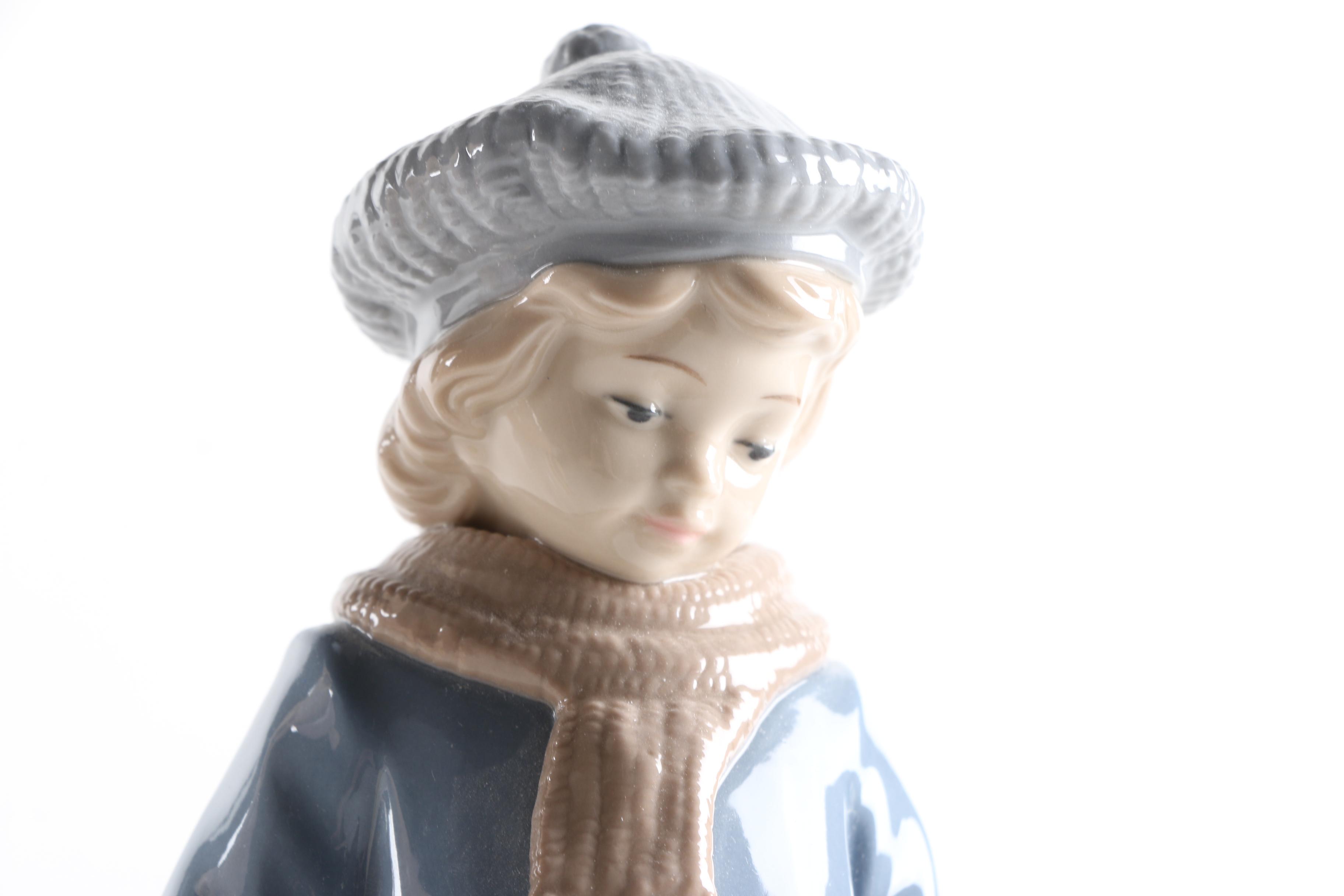 Porcelain Figurines of a Boy and Girl
