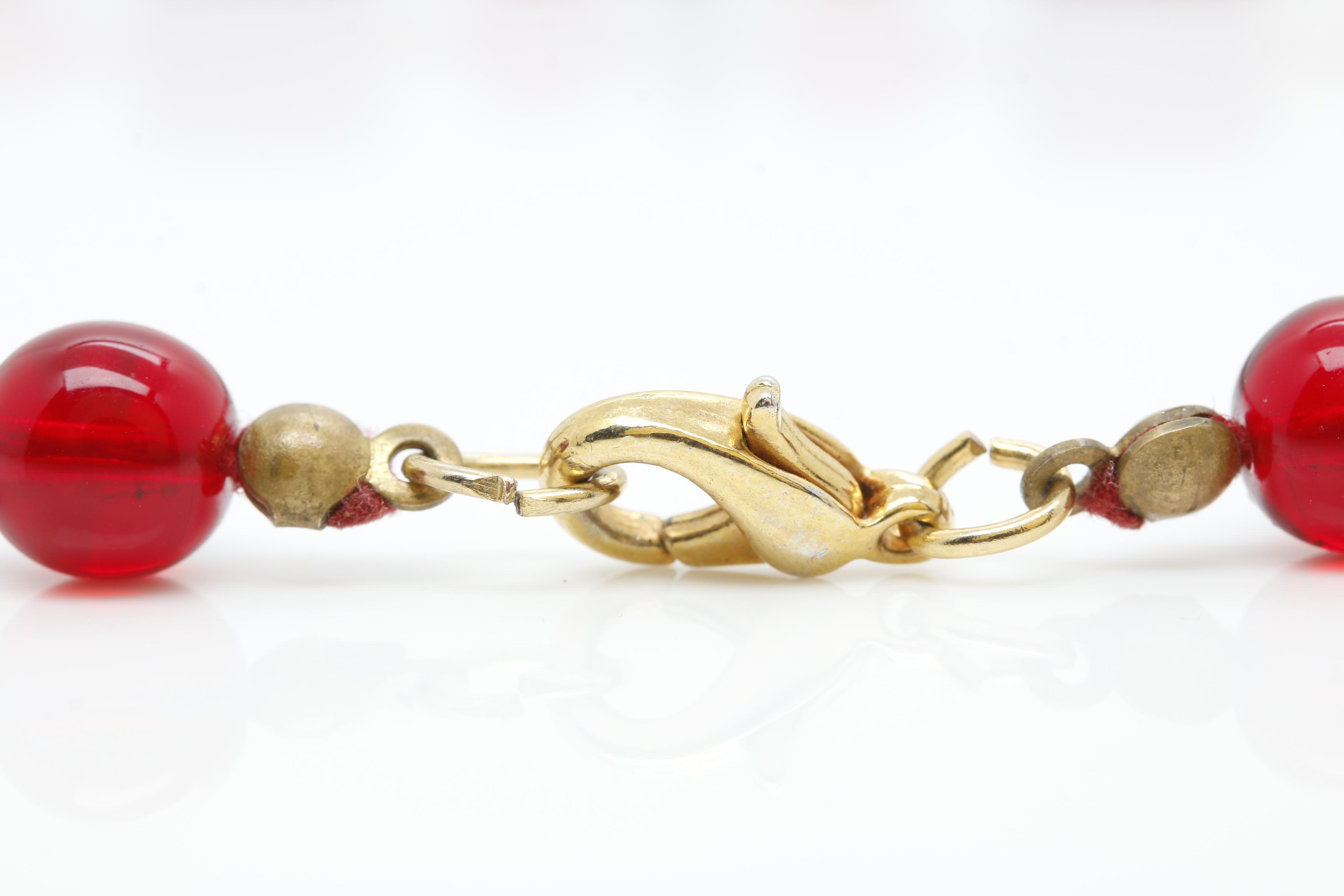 Gold Tone Jewelry Assortment Featuring Bakelite and Glass