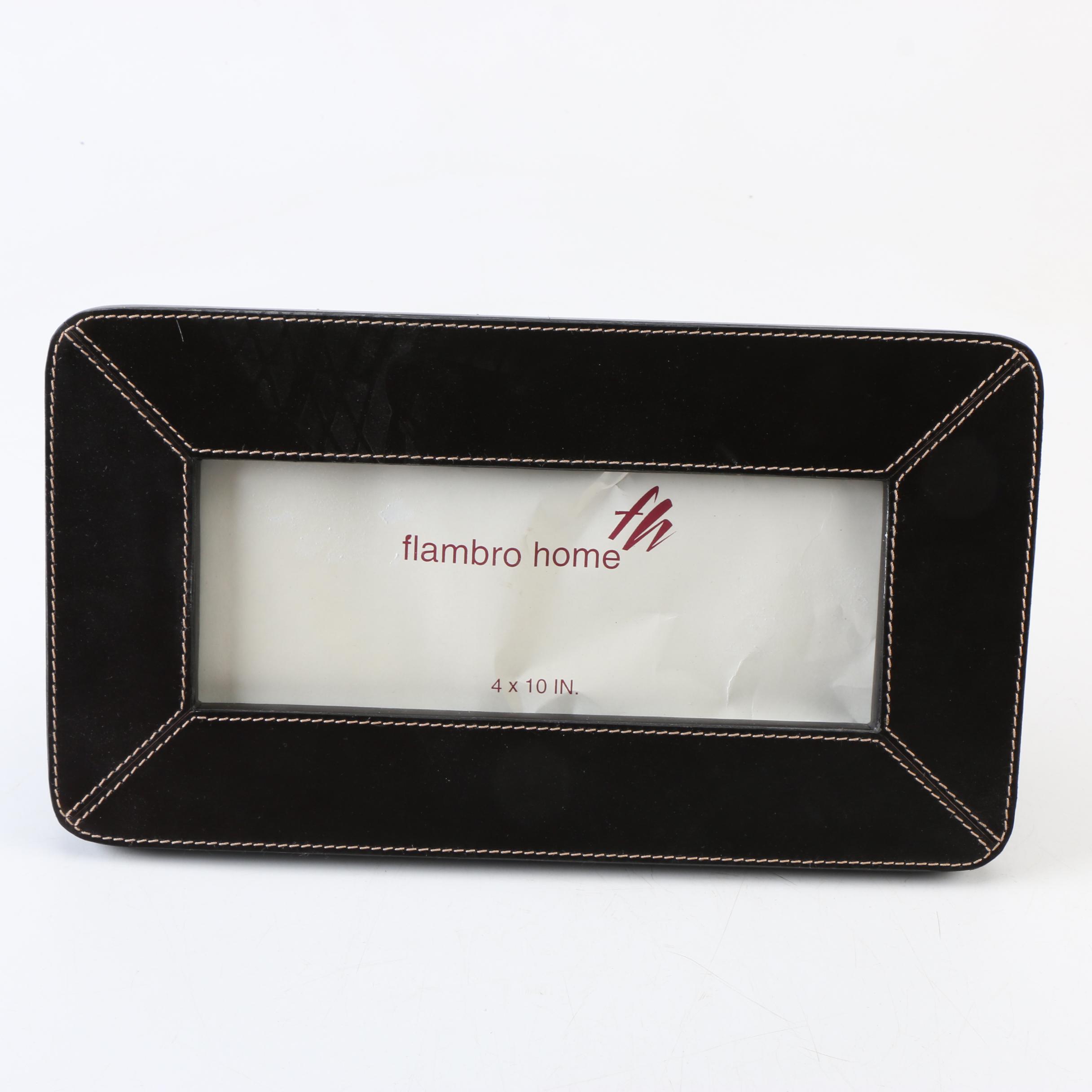 Two Magazine Racks, a Picture Frame, and an Ottoman