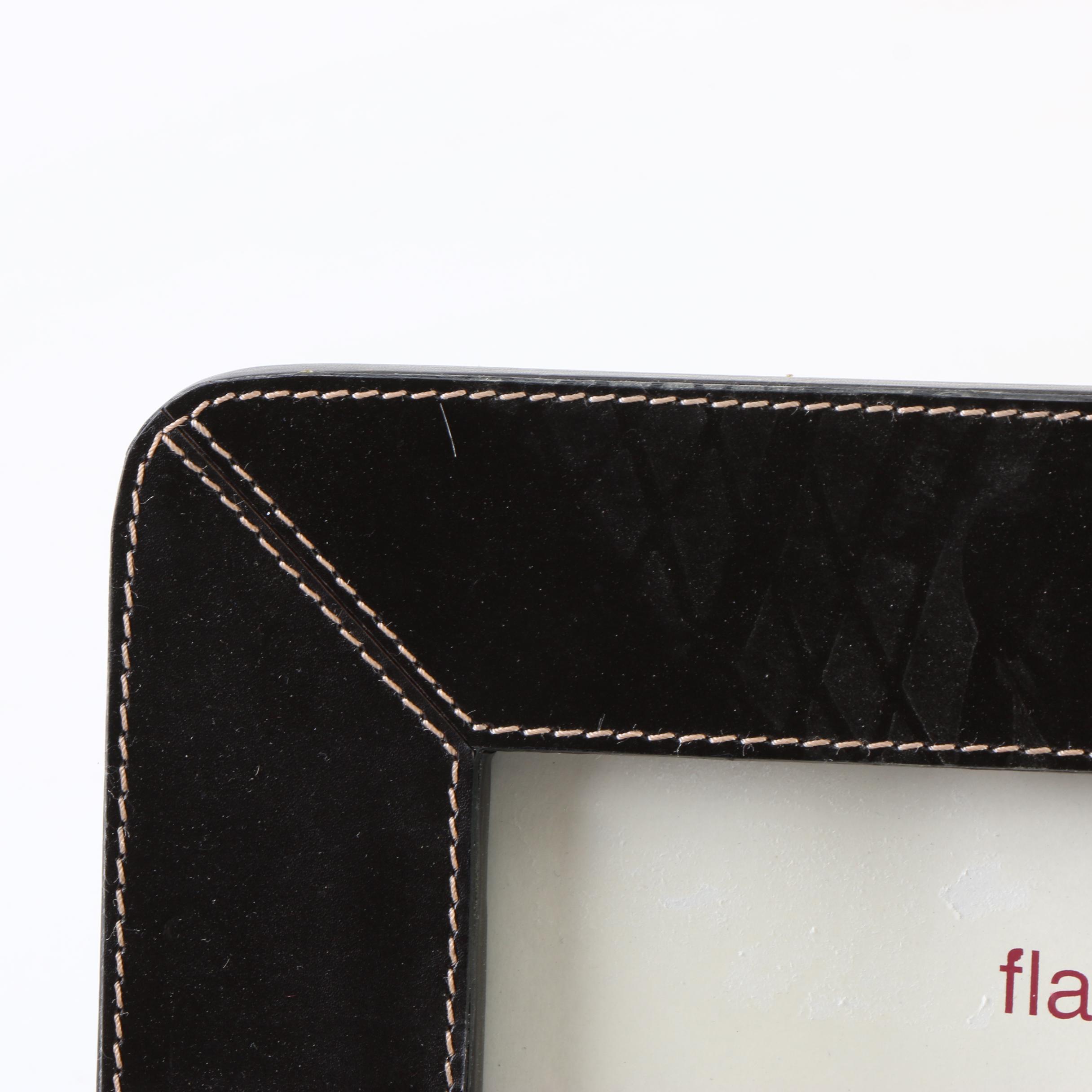 Two Magazine Racks, a Picture Frame, and an Ottoman