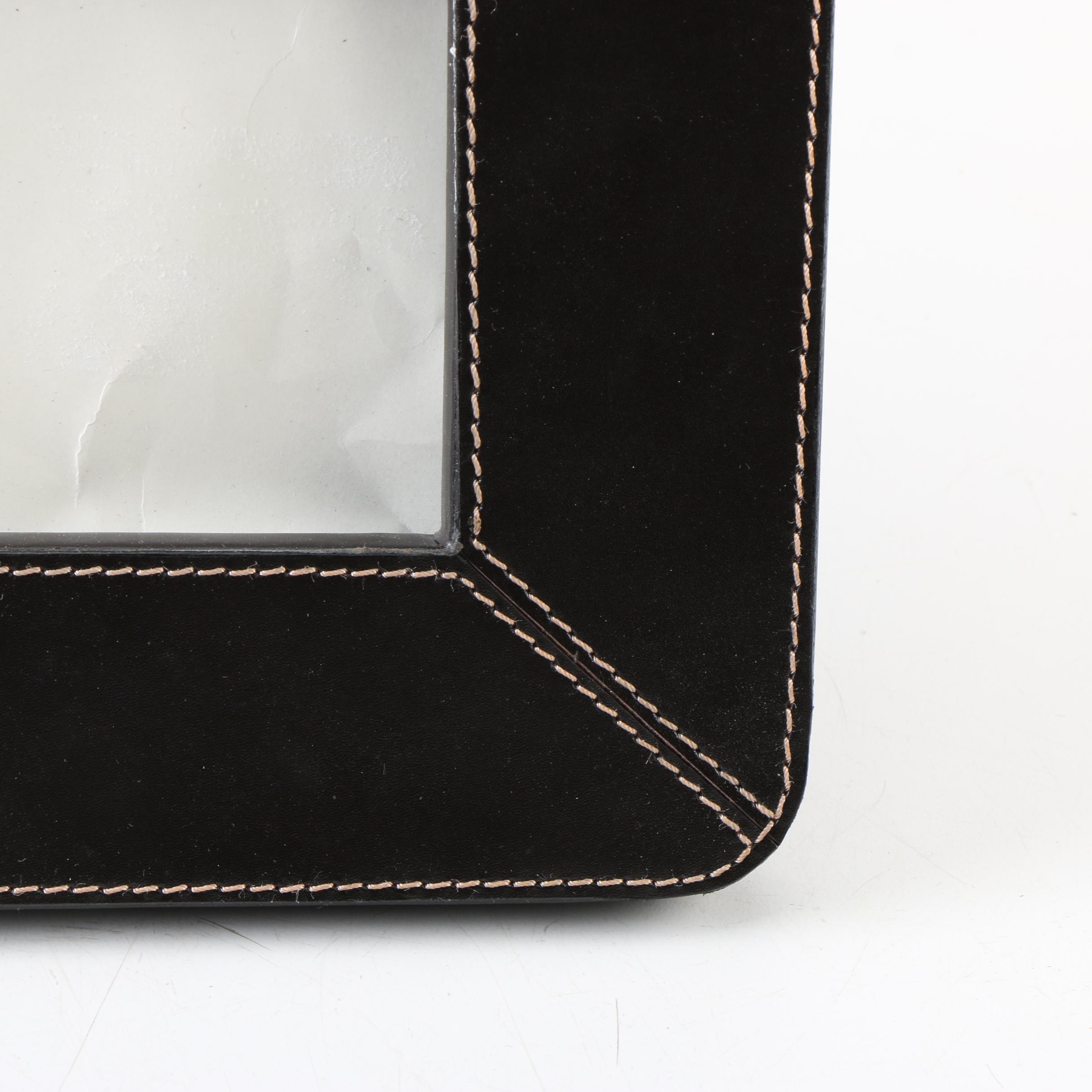 Two Magazine Racks, a Picture Frame, and an Ottoman