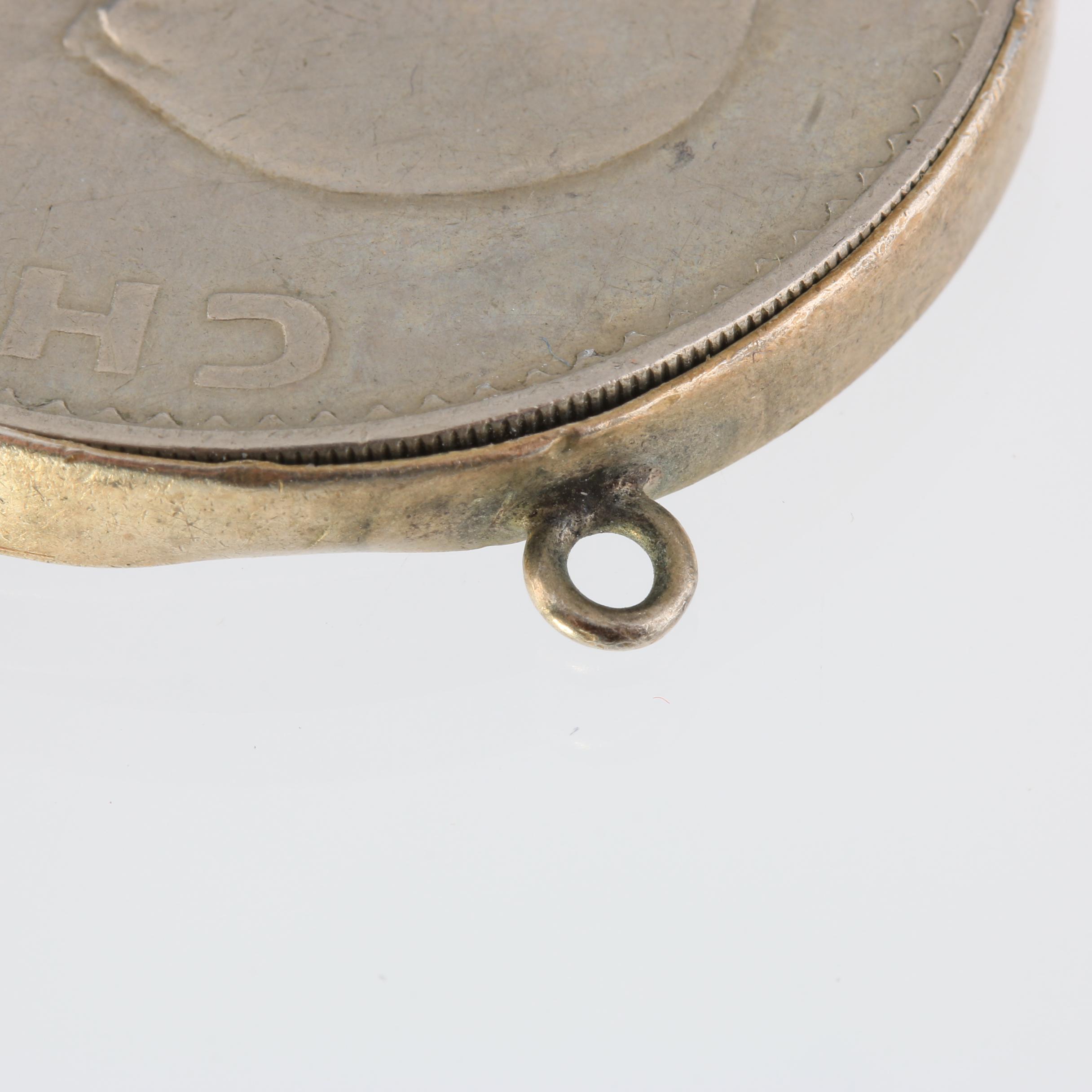 1965 United Kingdom One Crown Coin and a 1965 Mexico Fifty Centavos Coin