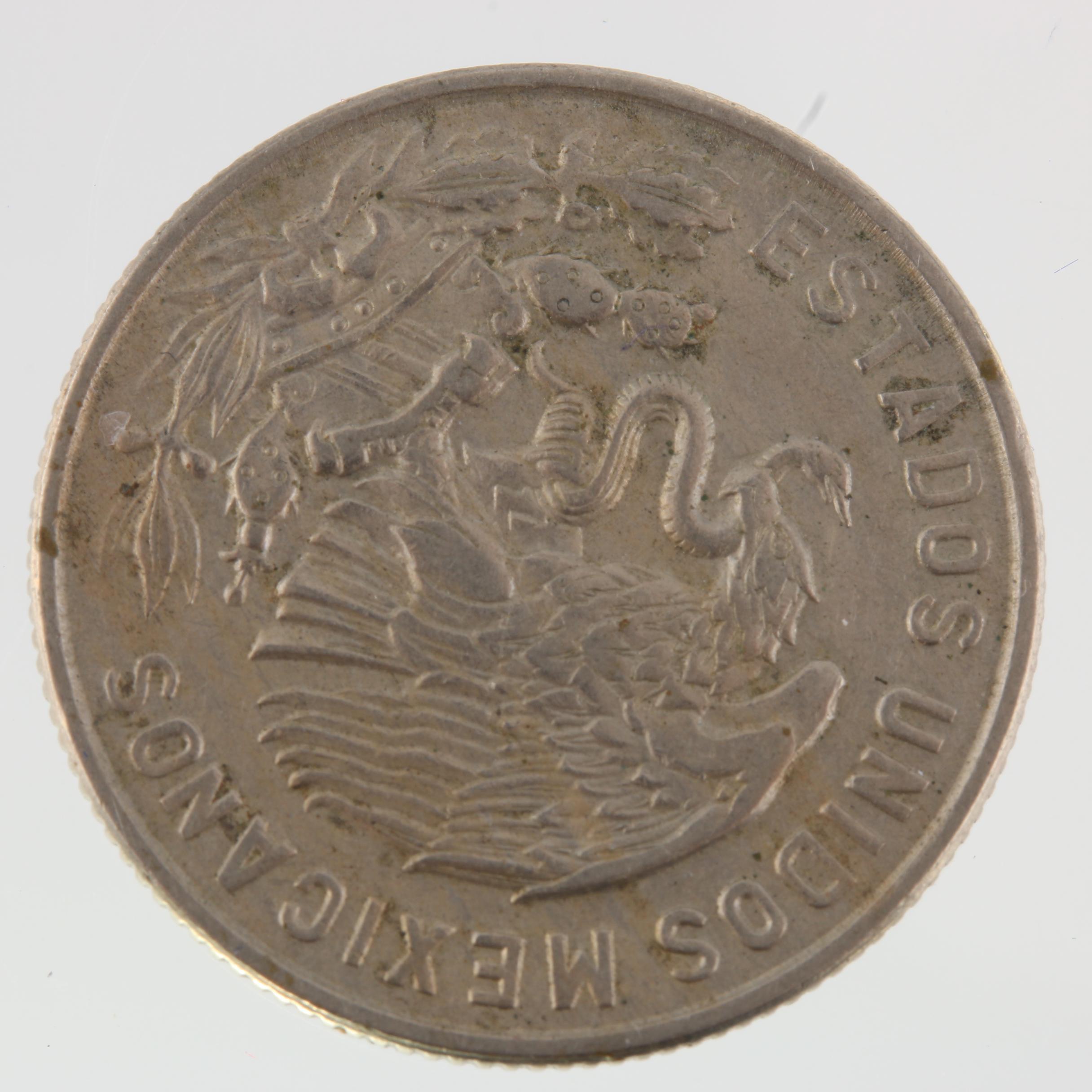 1965 United Kingdom One Crown Coin and a 1965 Mexico Fifty Centavos Coin