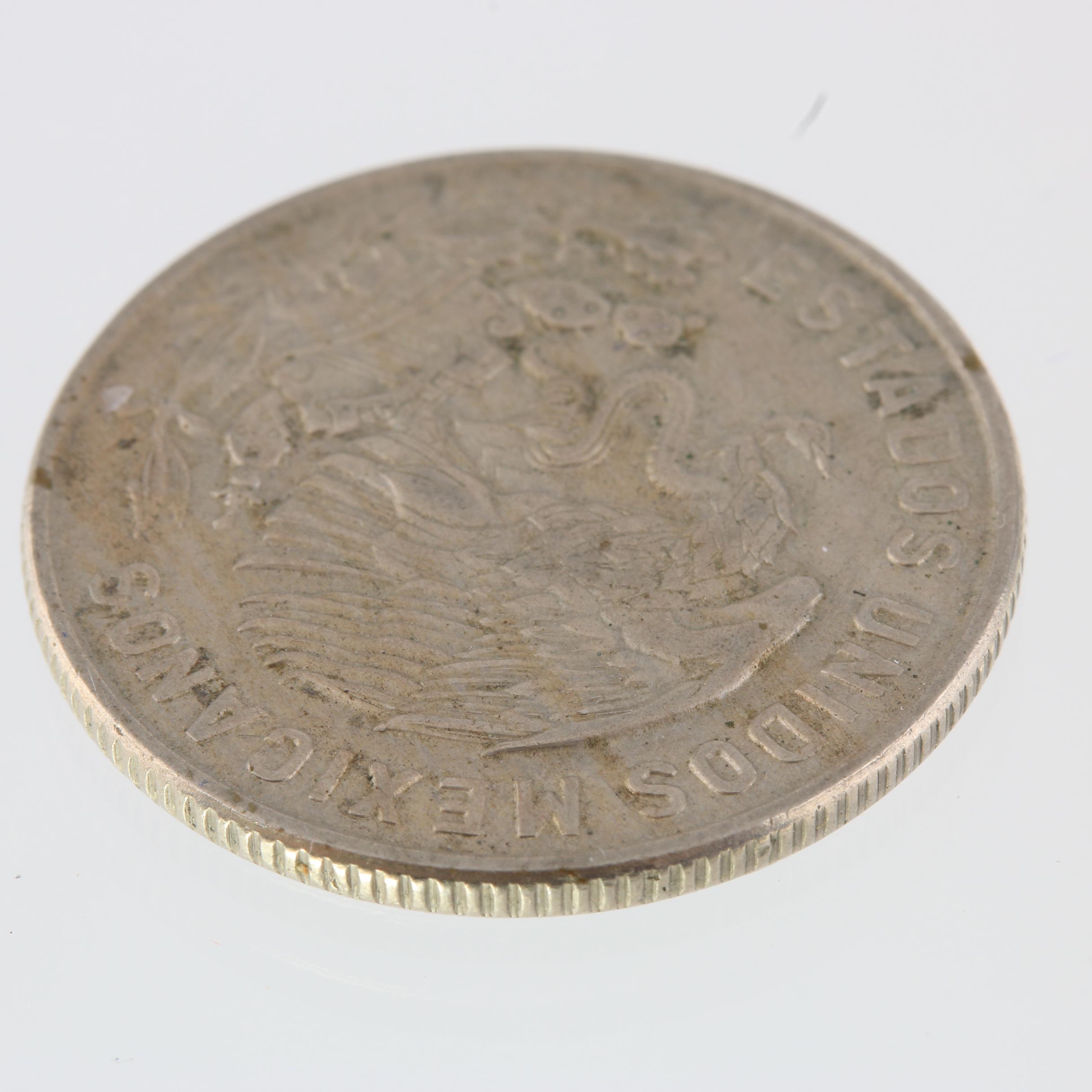 1965 United Kingdom One Crown Coin and a 1965 Mexico Fifty Centavos Coin