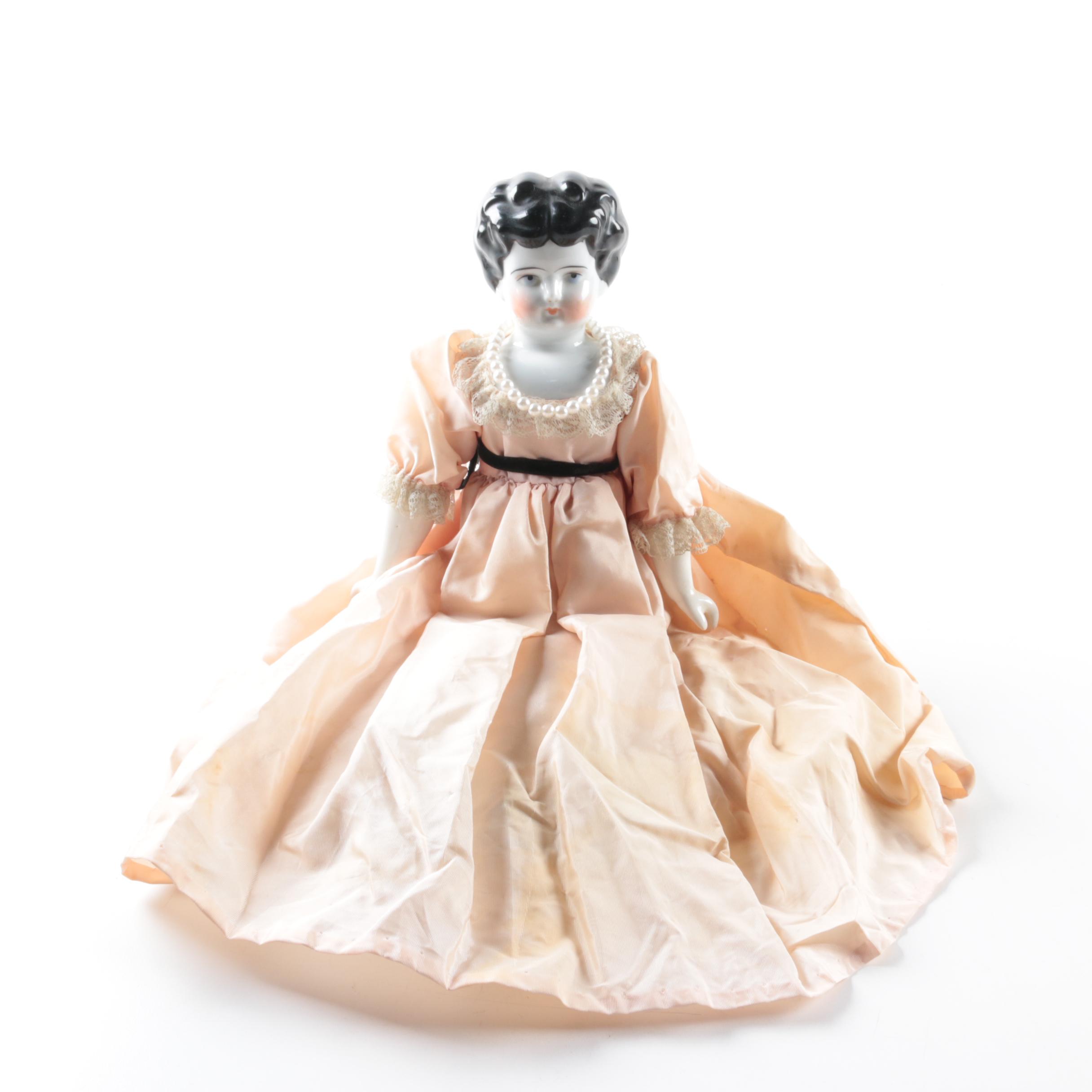 Vintage China Head Doll in Peach Dress