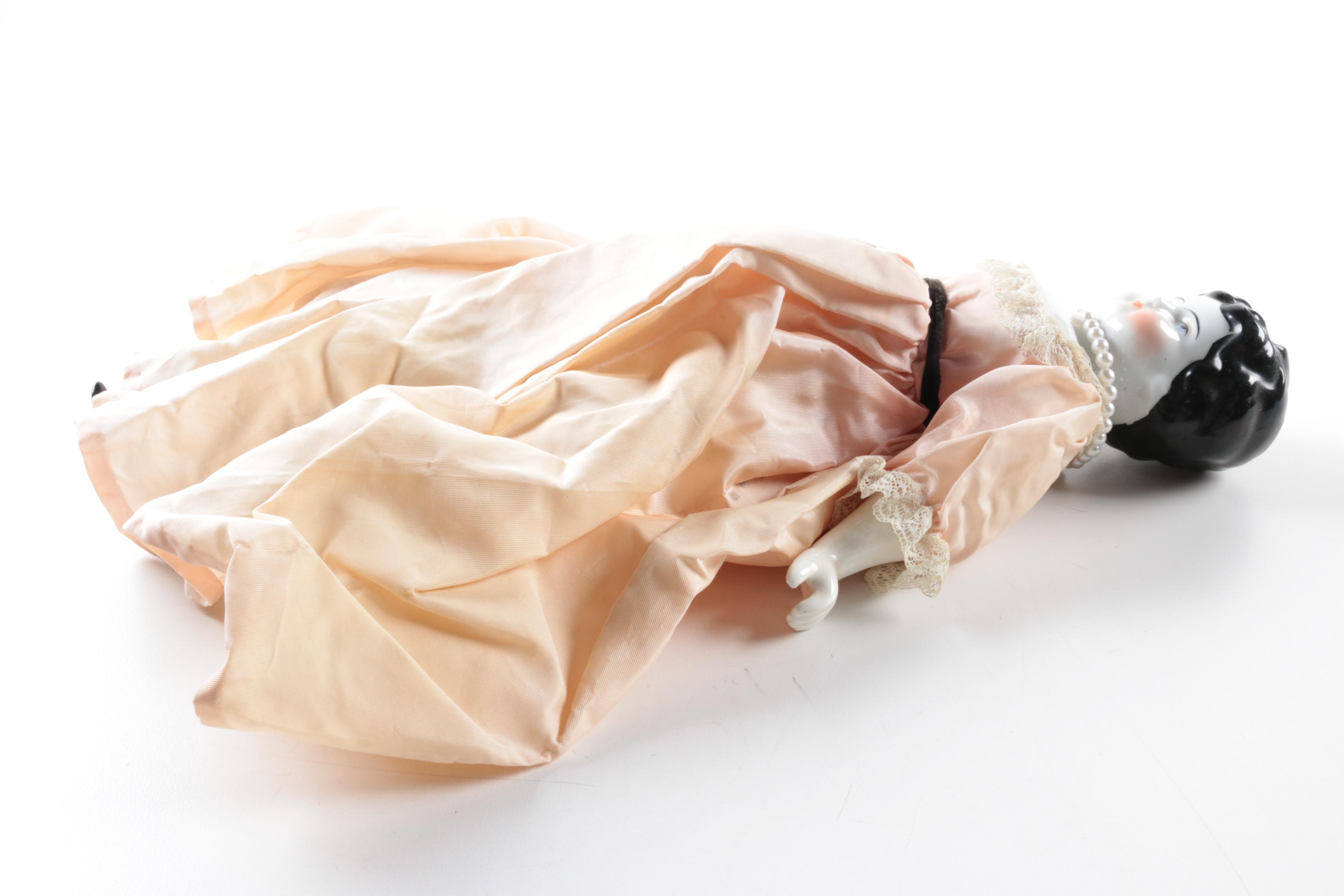 Vintage China Head Doll in Peach Dress