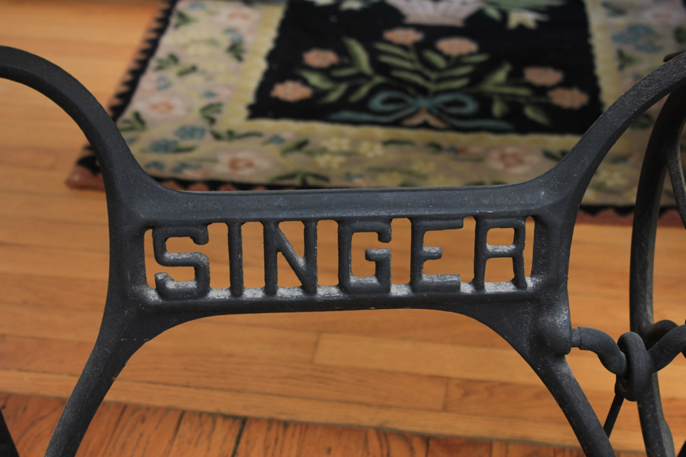 Stone-Top Table With Singer Sewing Machine Base