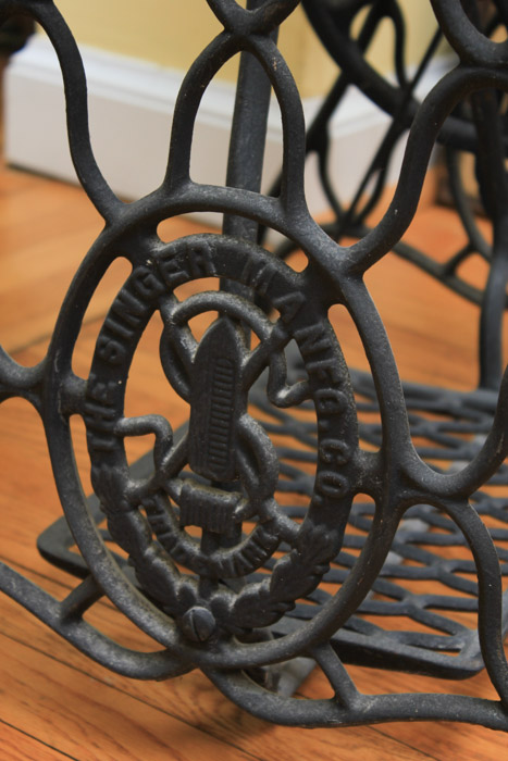 Stone-Top Table With Singer Sewing Machine Base