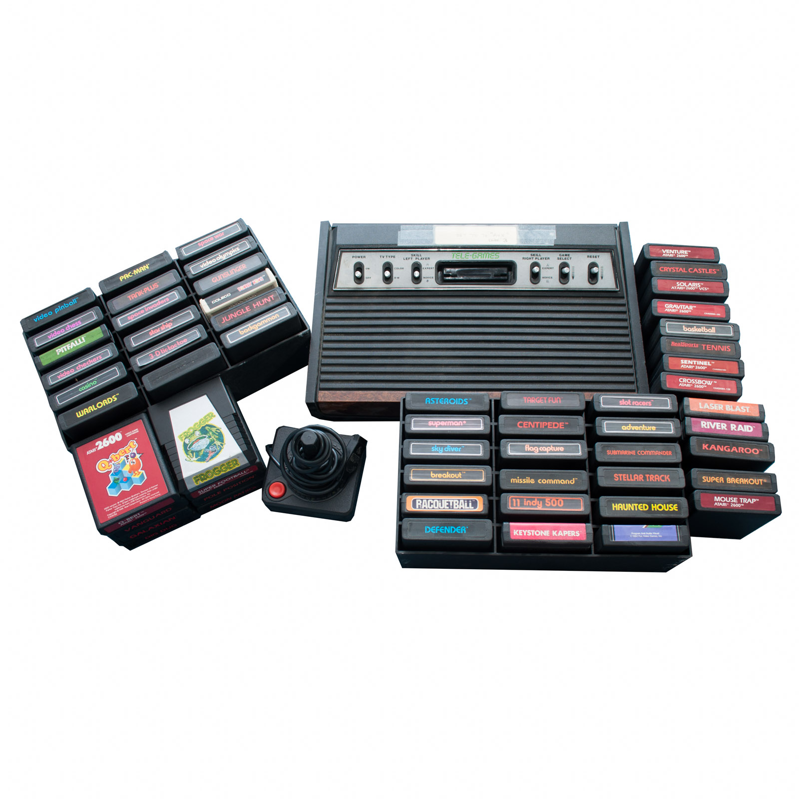 Vintage Atari Game Console with Paddles and Games