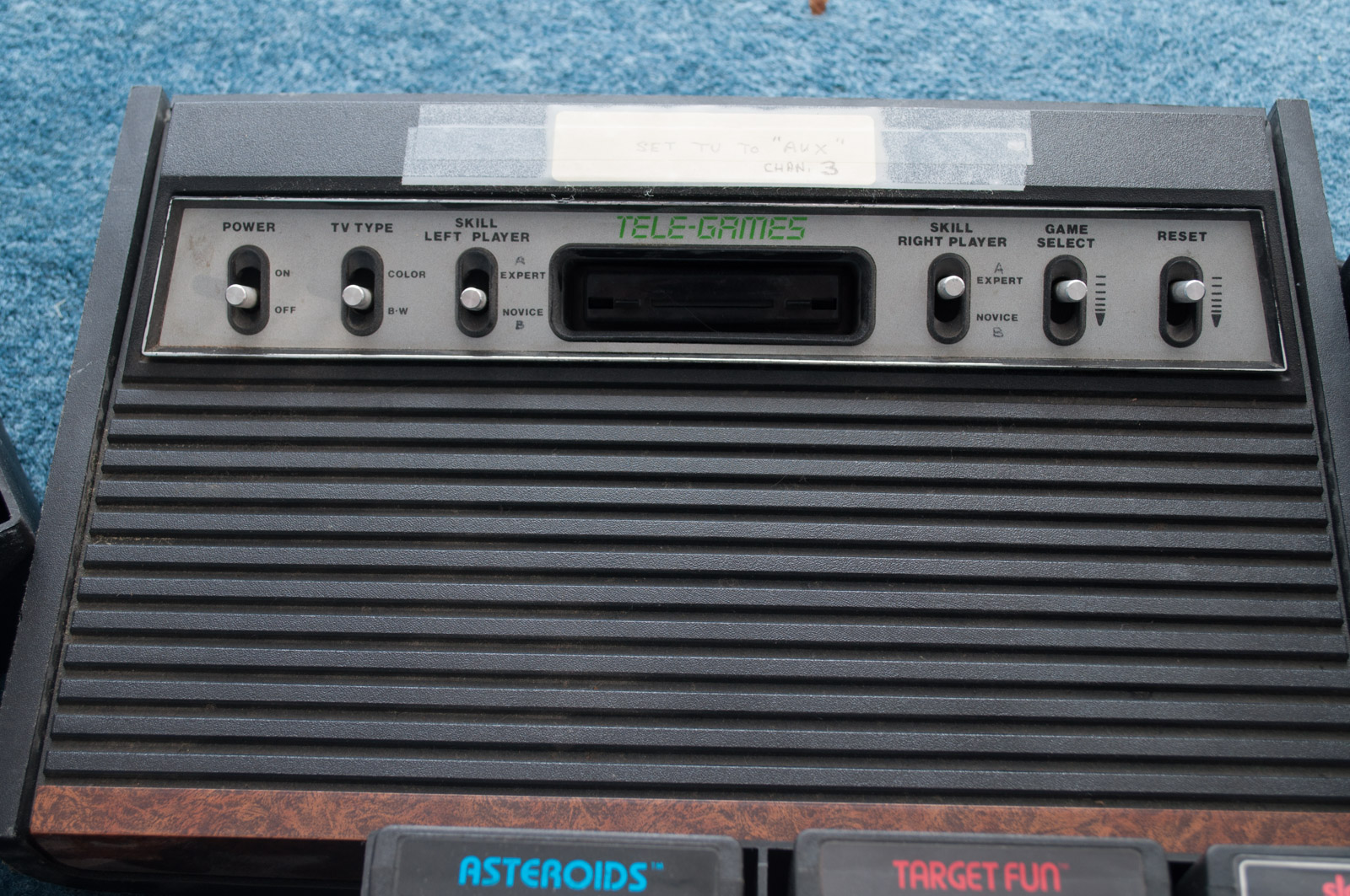 Vintage Atari Game Console with Paddles and Games