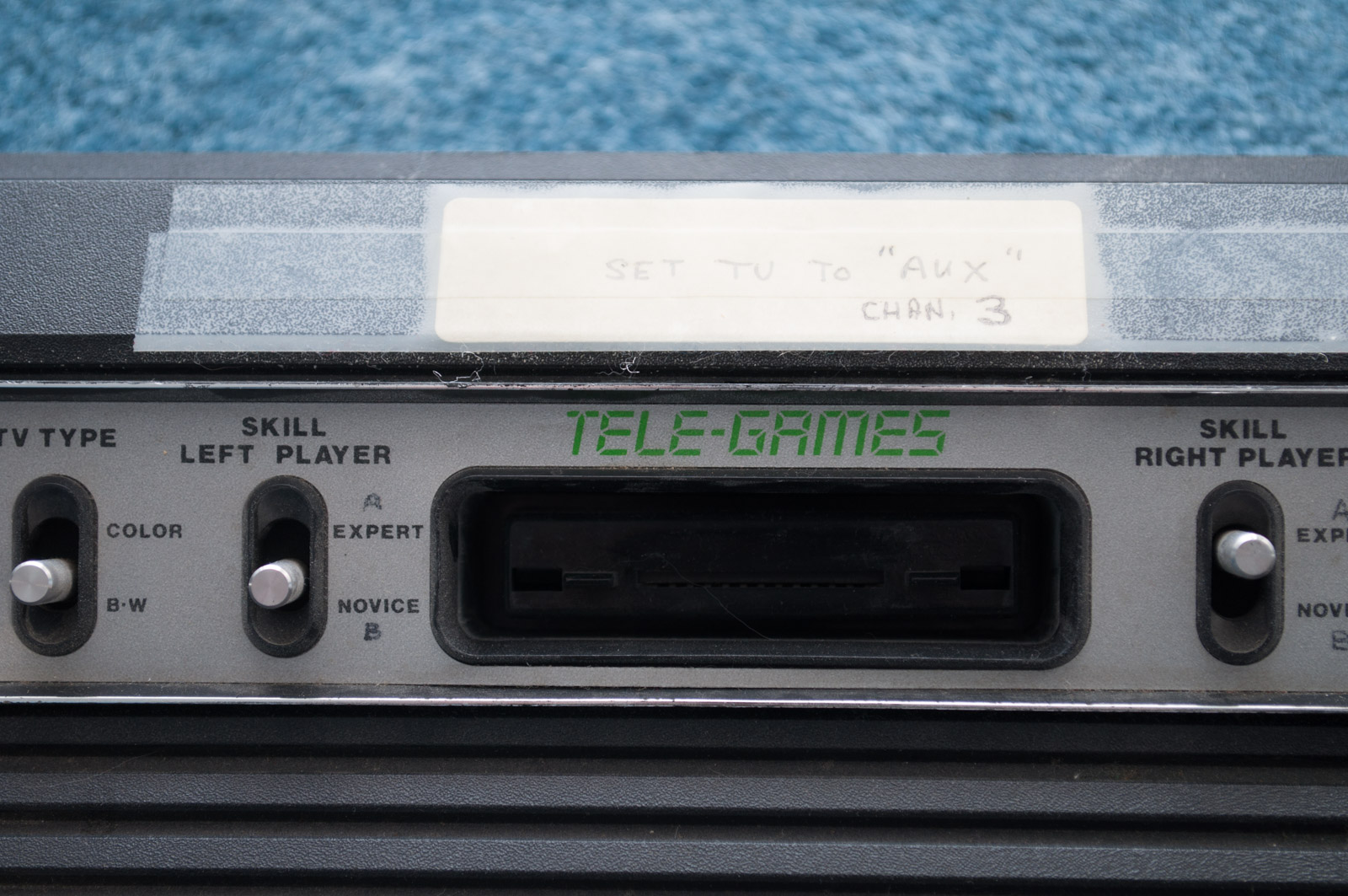 Vintage Atari Game Console with Paddles and Games