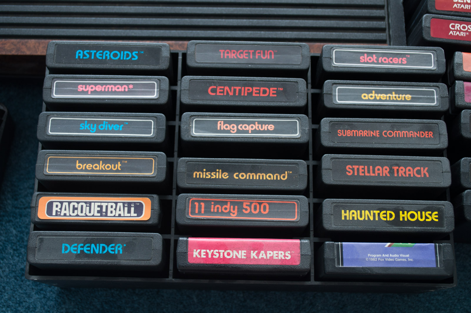 Vintage Atari Game Console with Paddles and Games