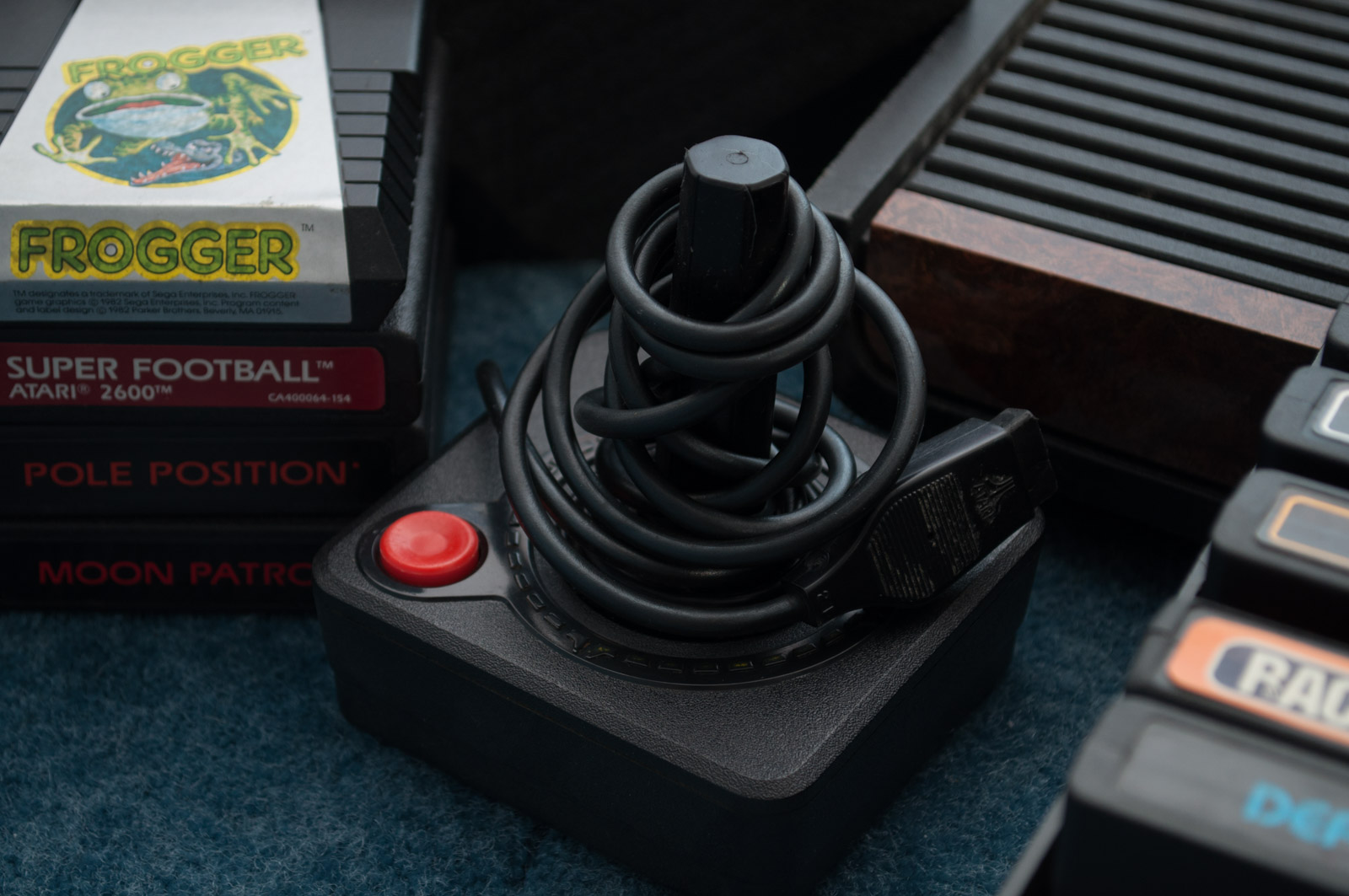 Vintage Atari Game Console with Paddles and Games