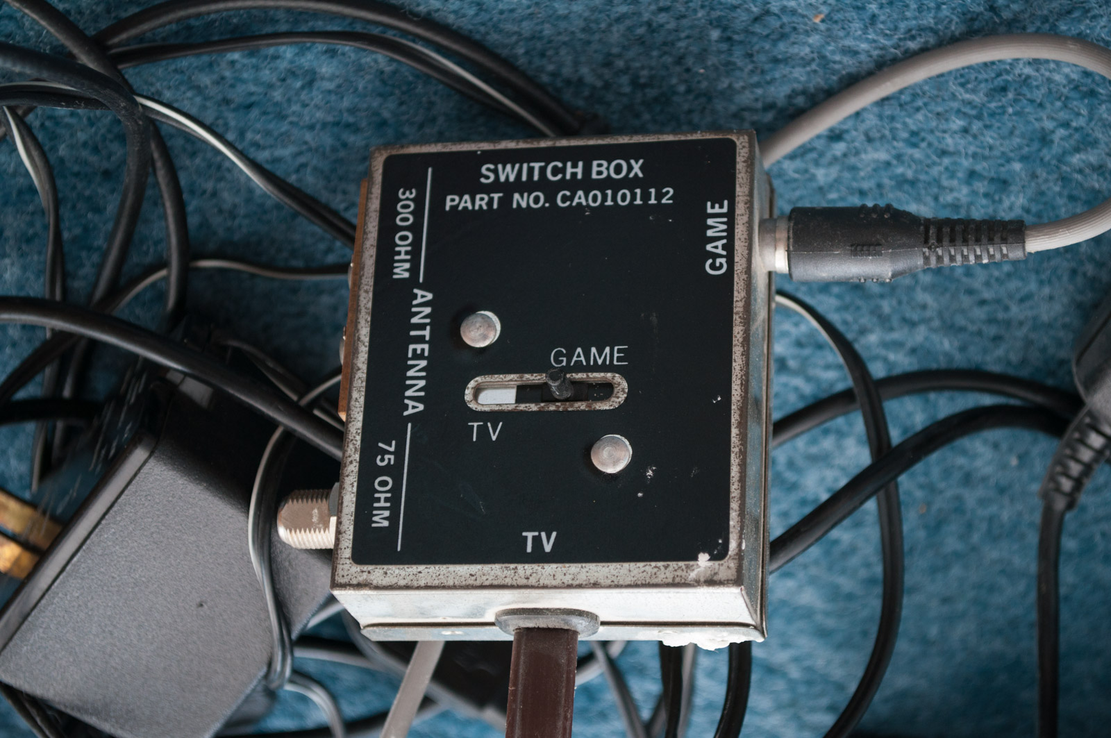 Vintage Atari Game Console with Paddles and Games