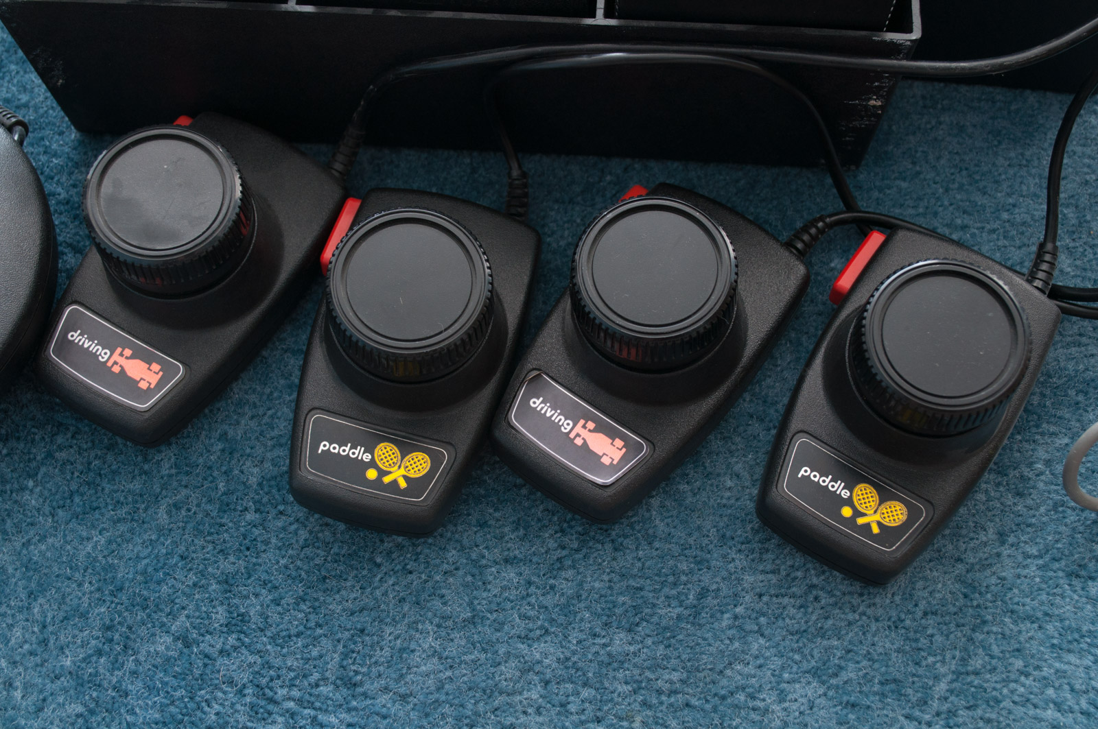 Vintage Atari Game Console with Paddles and Games