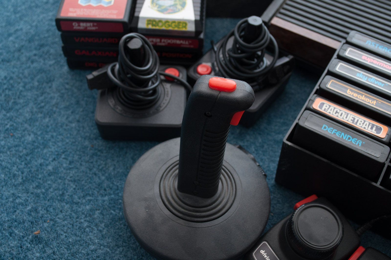 Vintage Atari Game Console with Paddles and Games