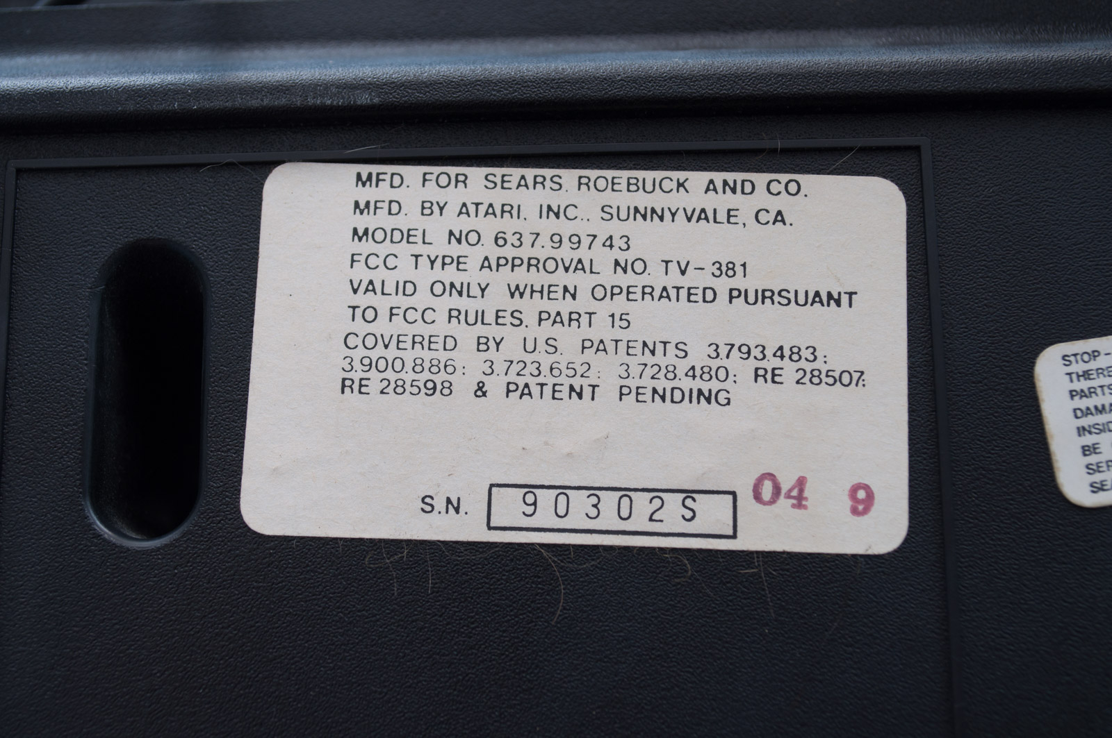 Vintage Atari Game Console with Paddles and Games