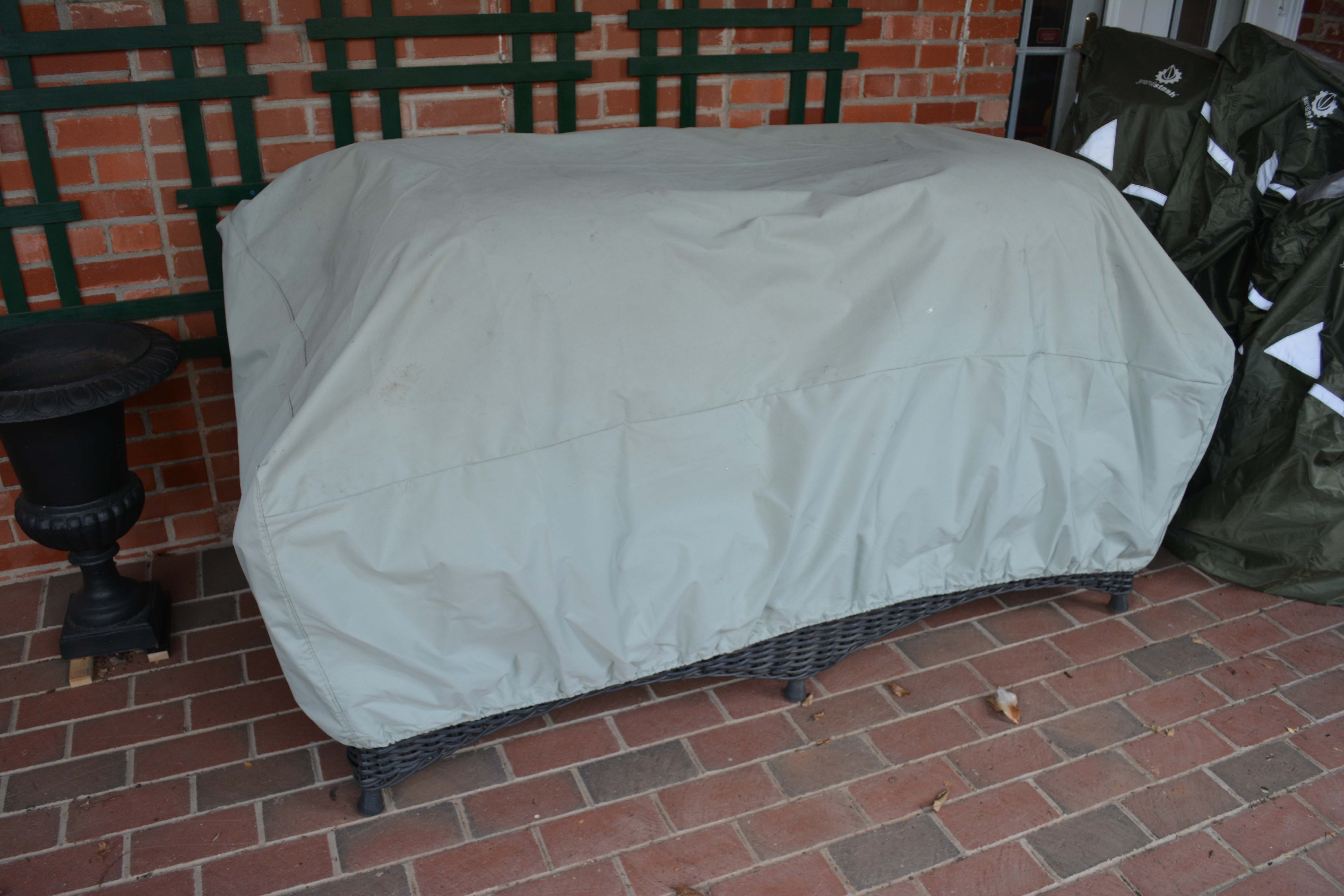 Black Plastic Wicker Sofa and Two Ottomans