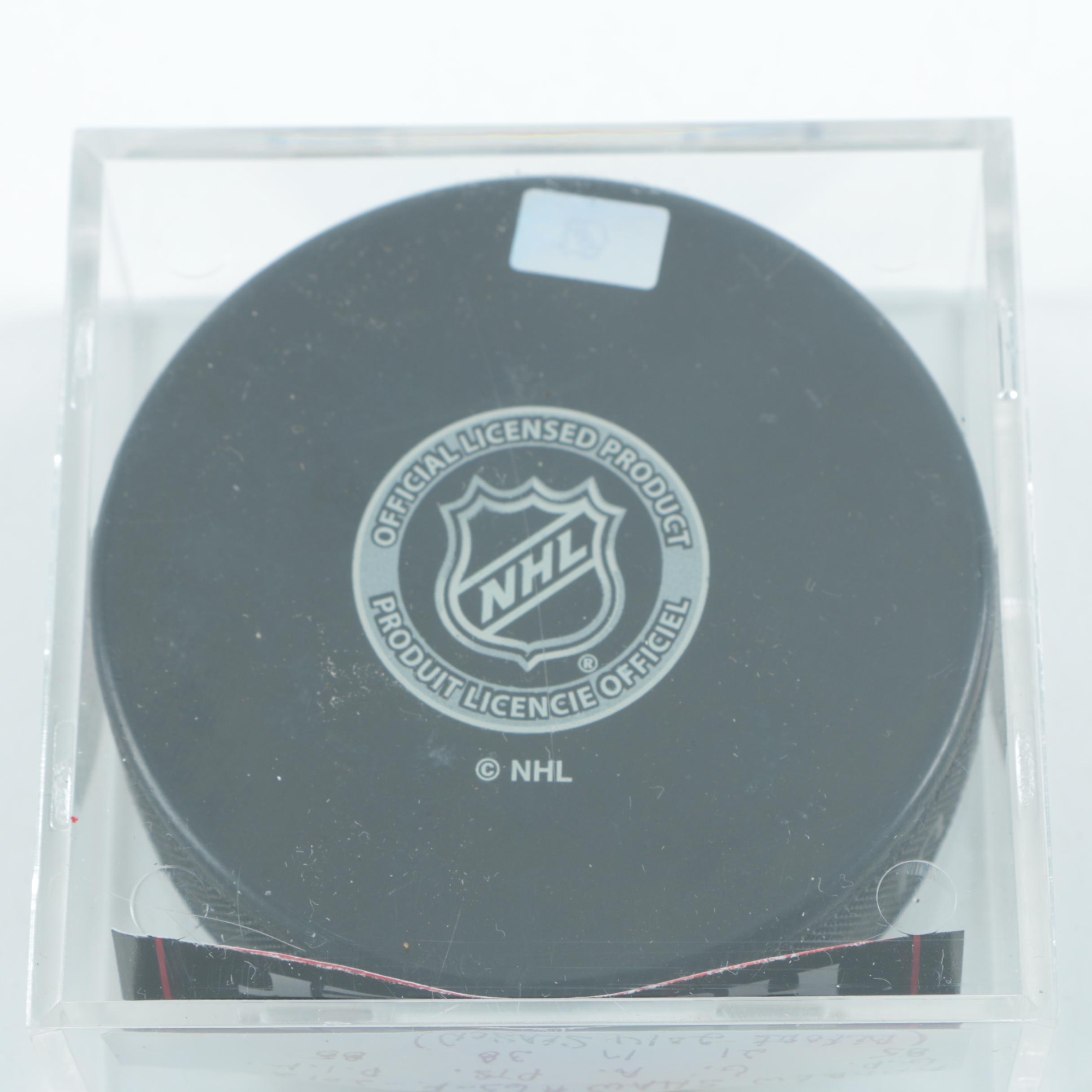 Autographed Andrew Shaw Chicago Blackhawks Pucks with Blackhawks Hat