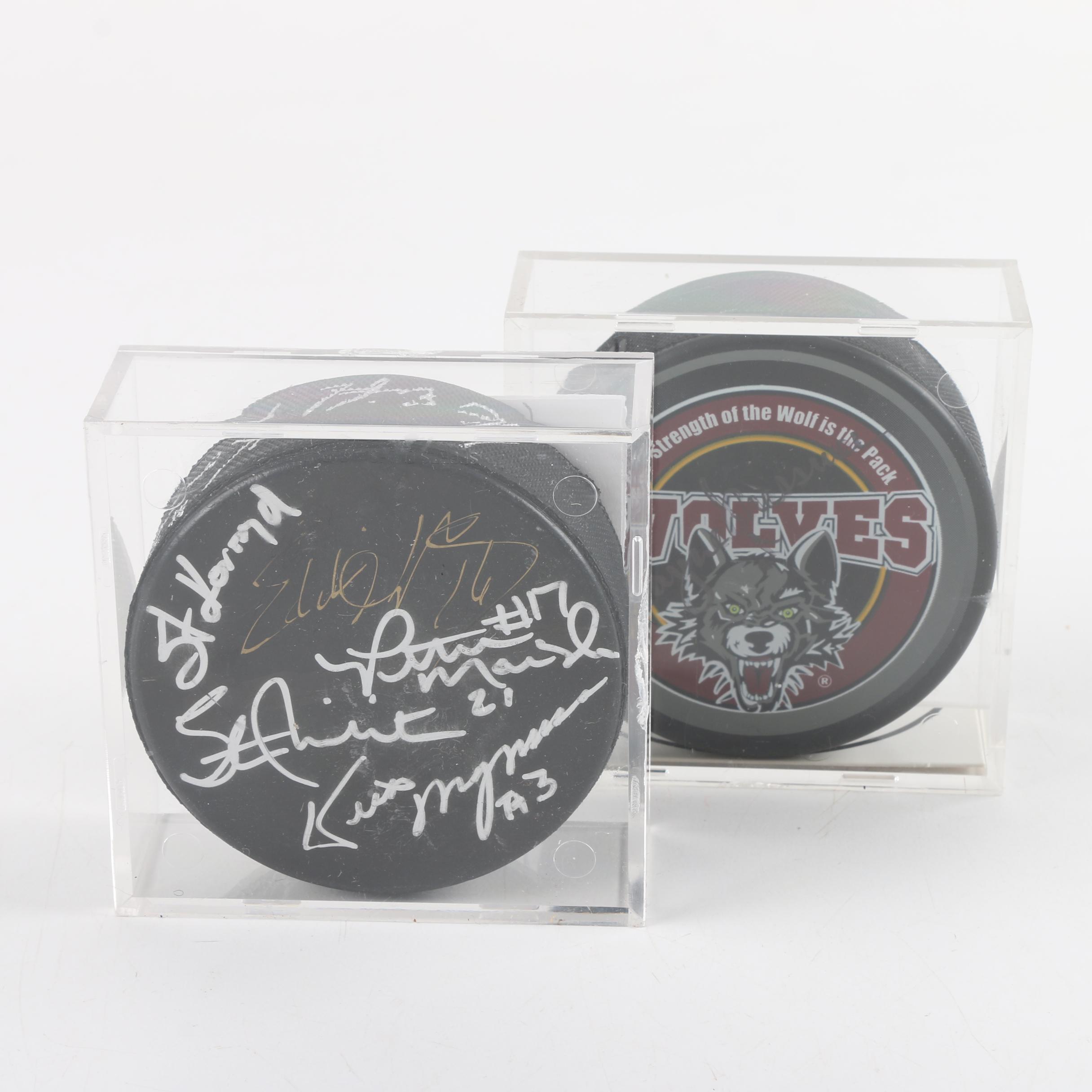 Autographed Chicago Blackhawks and Chicago Wolves Hockey Pucks