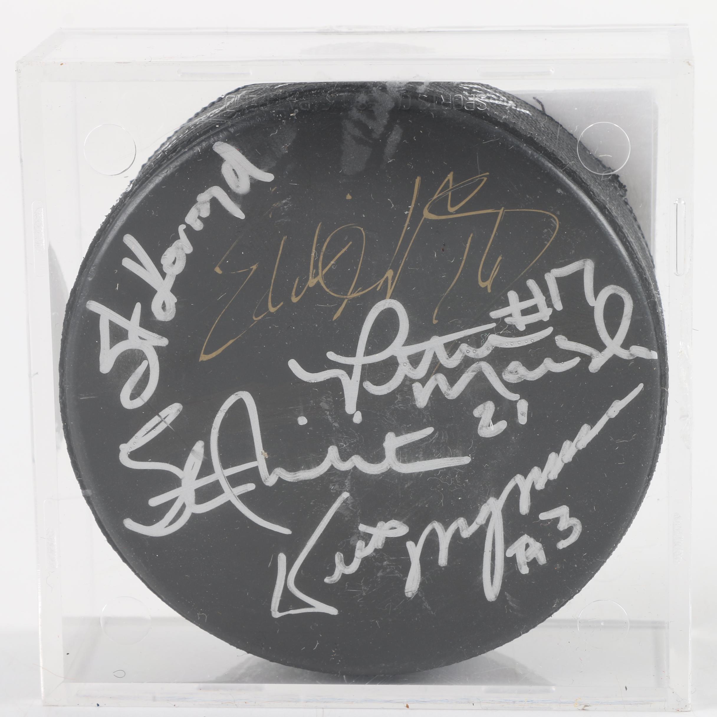 Autographed Chicago Blackhawks and Chicago Wolves Hockey Pucks