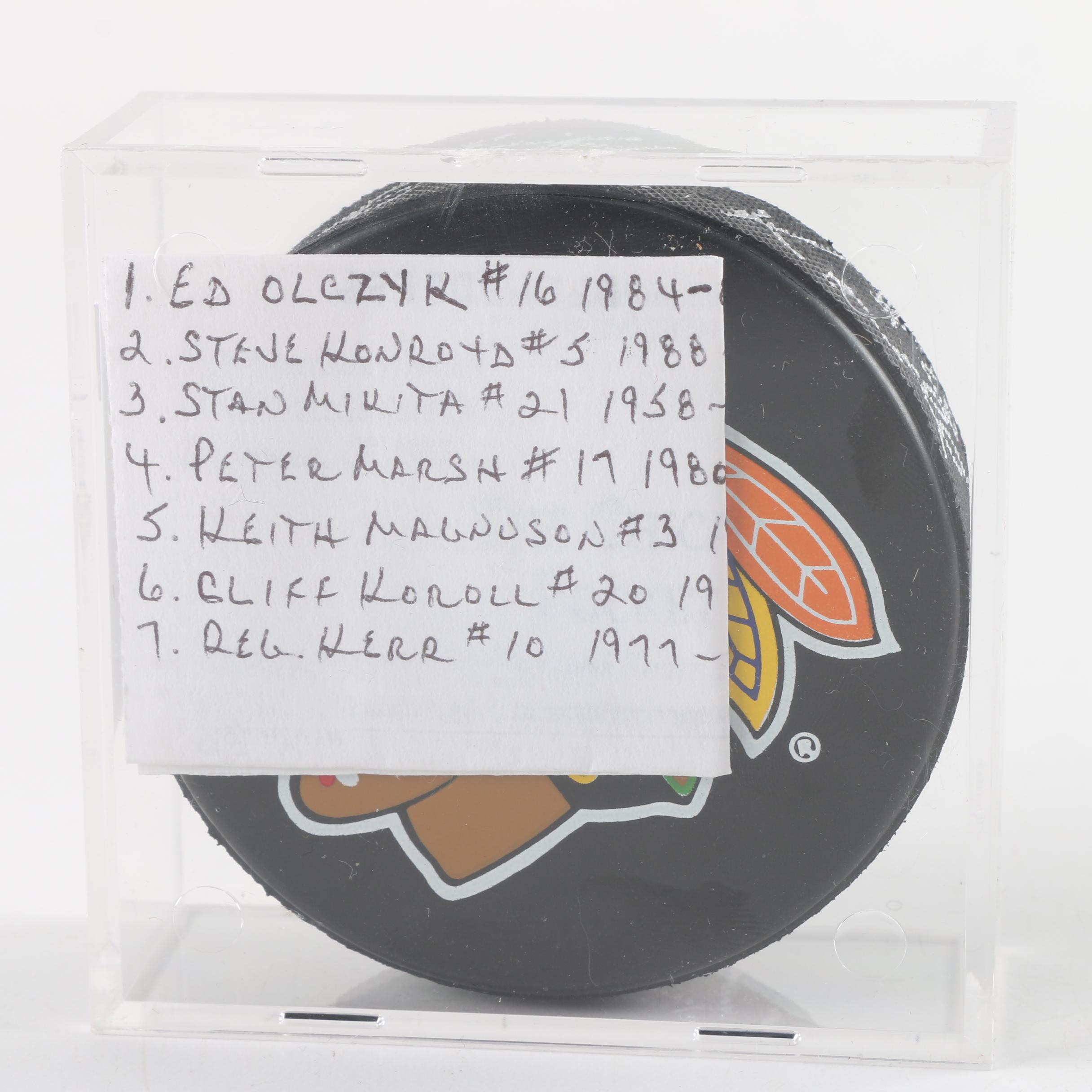 Autographed Chicago Blackhawks and Chicago Wolves Hockey Pucks