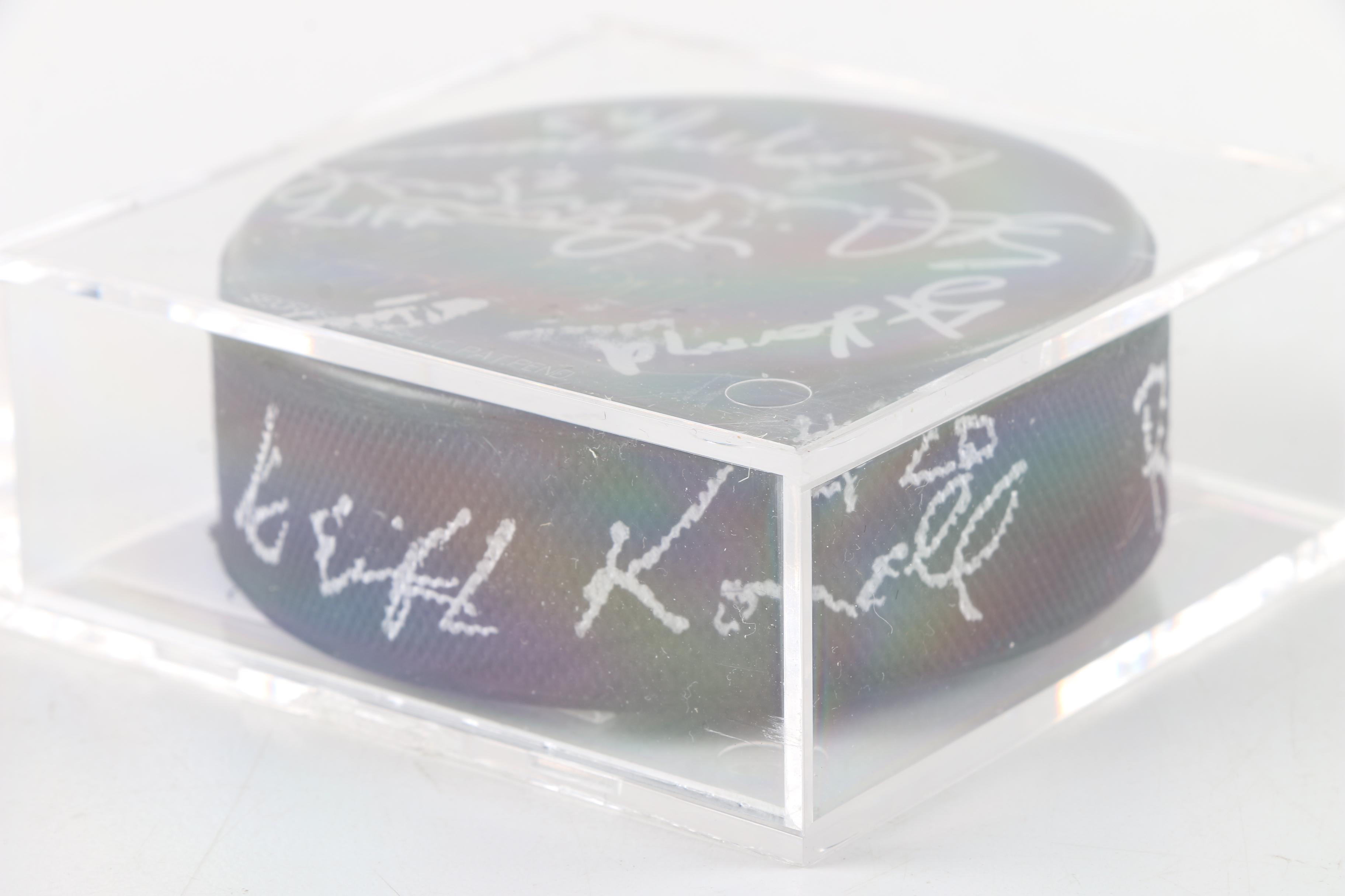 Autographed Chicago Blackhawks and Chicago Wolves Hockey Pucks