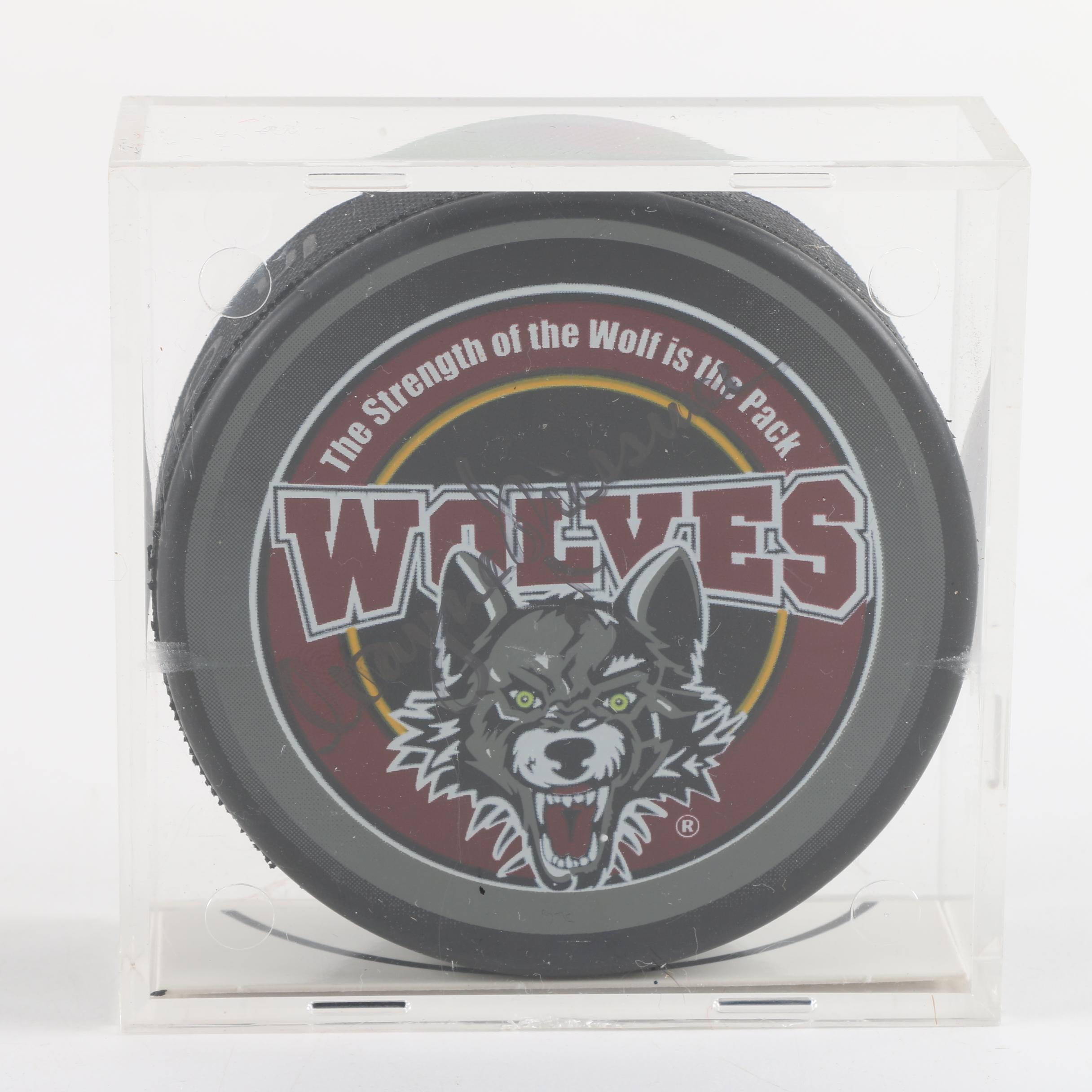 Autographed Chicago Blackhawks and Chicago Wolves Hockey Pucks