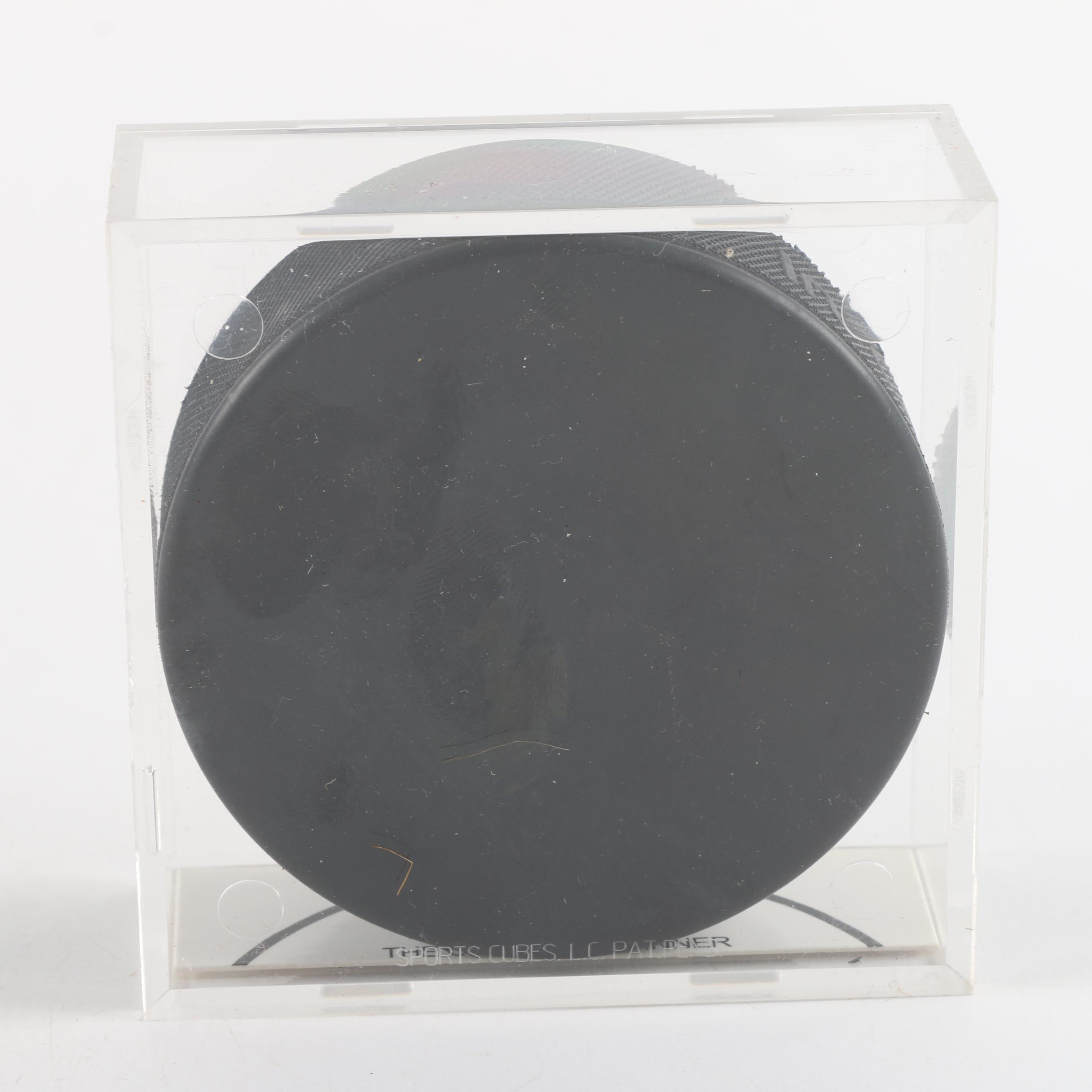 Autographed Chicago Blackhawks and Chicago Wolves Hockey Pucks