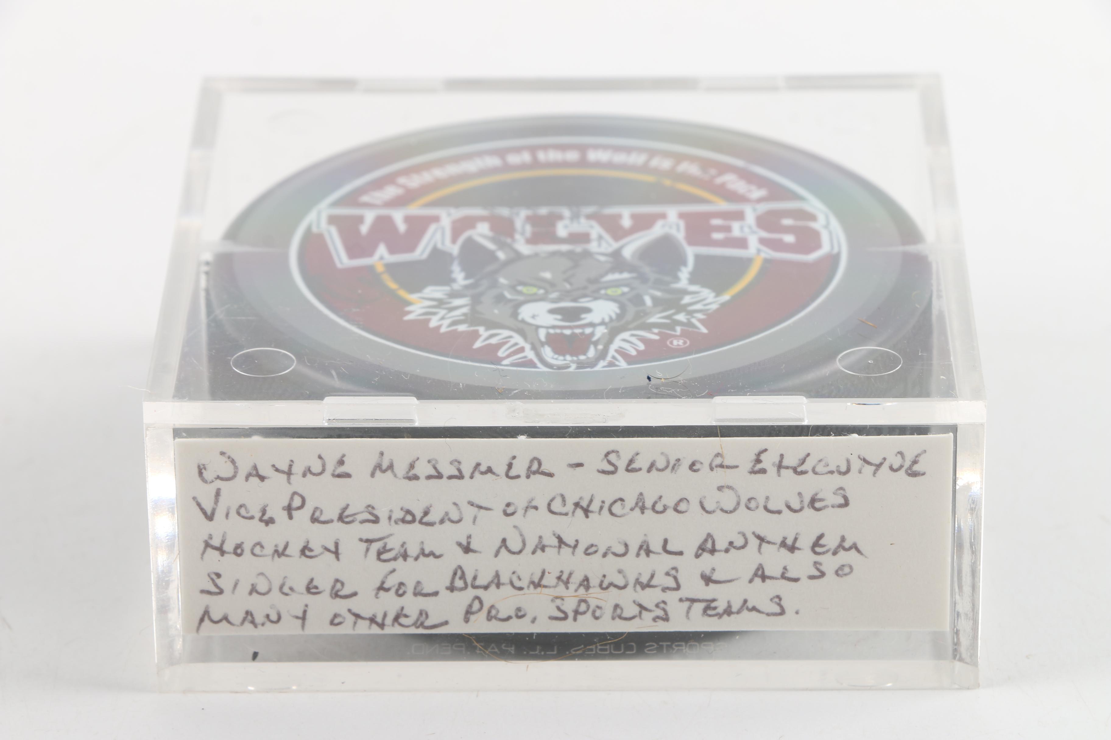 Autographed Chicago Blackhawks and Chicago Wolves Hockey Pucks