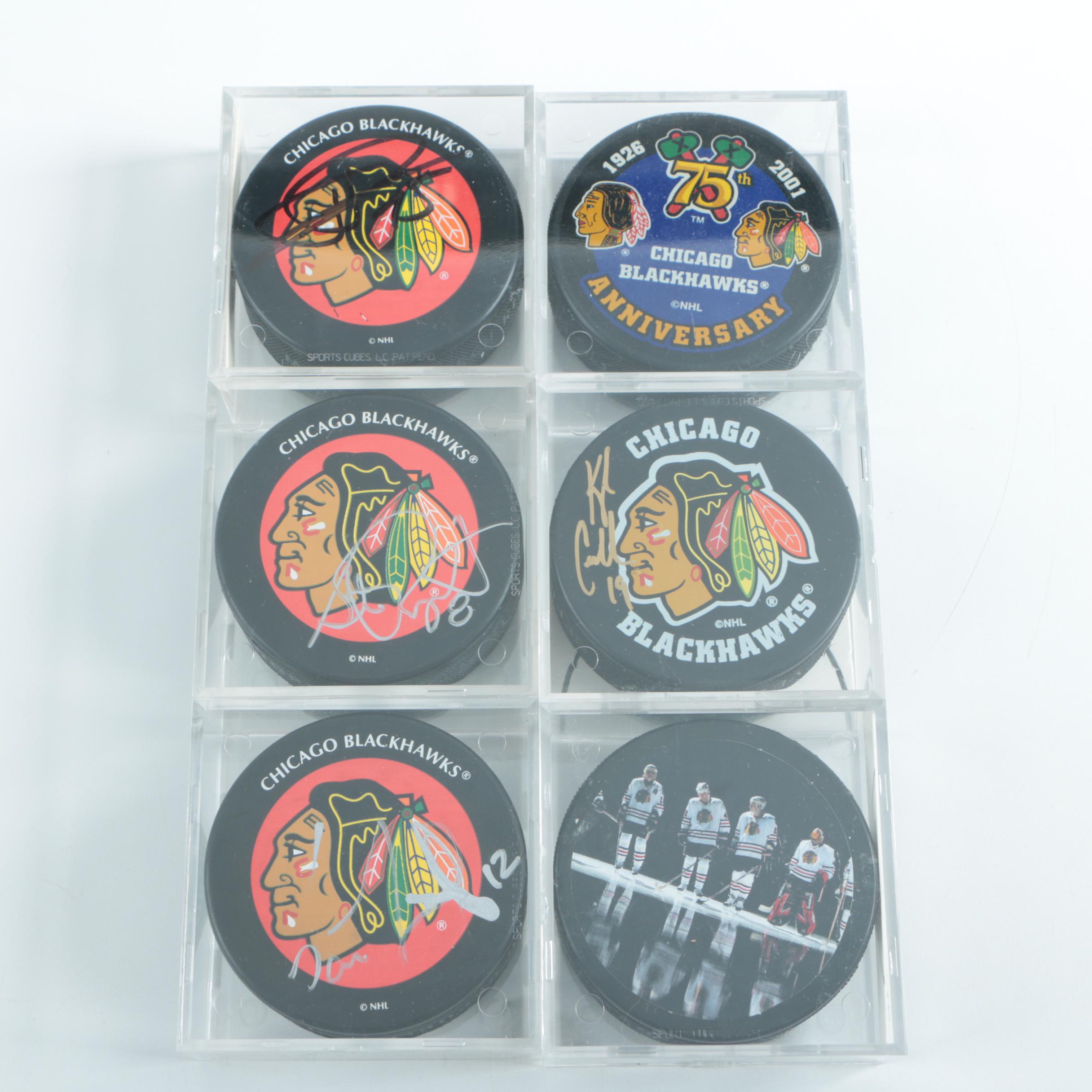Autographed Chicago Blackhawks Hockey Pucks with 75th Anniversary Puck