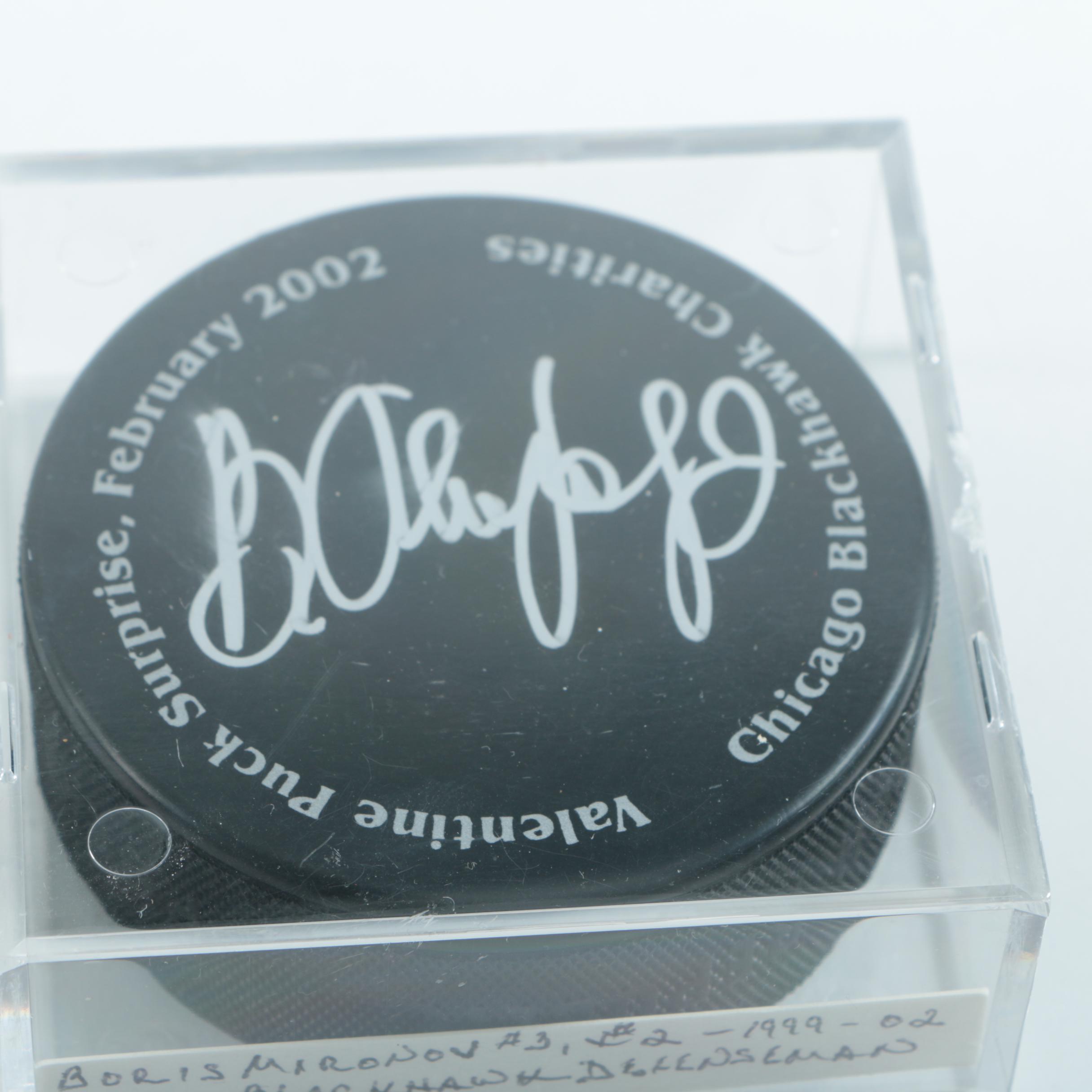 Autographed Chicago Blackhawks Hockey Pucks with 75th Anniversary Puck