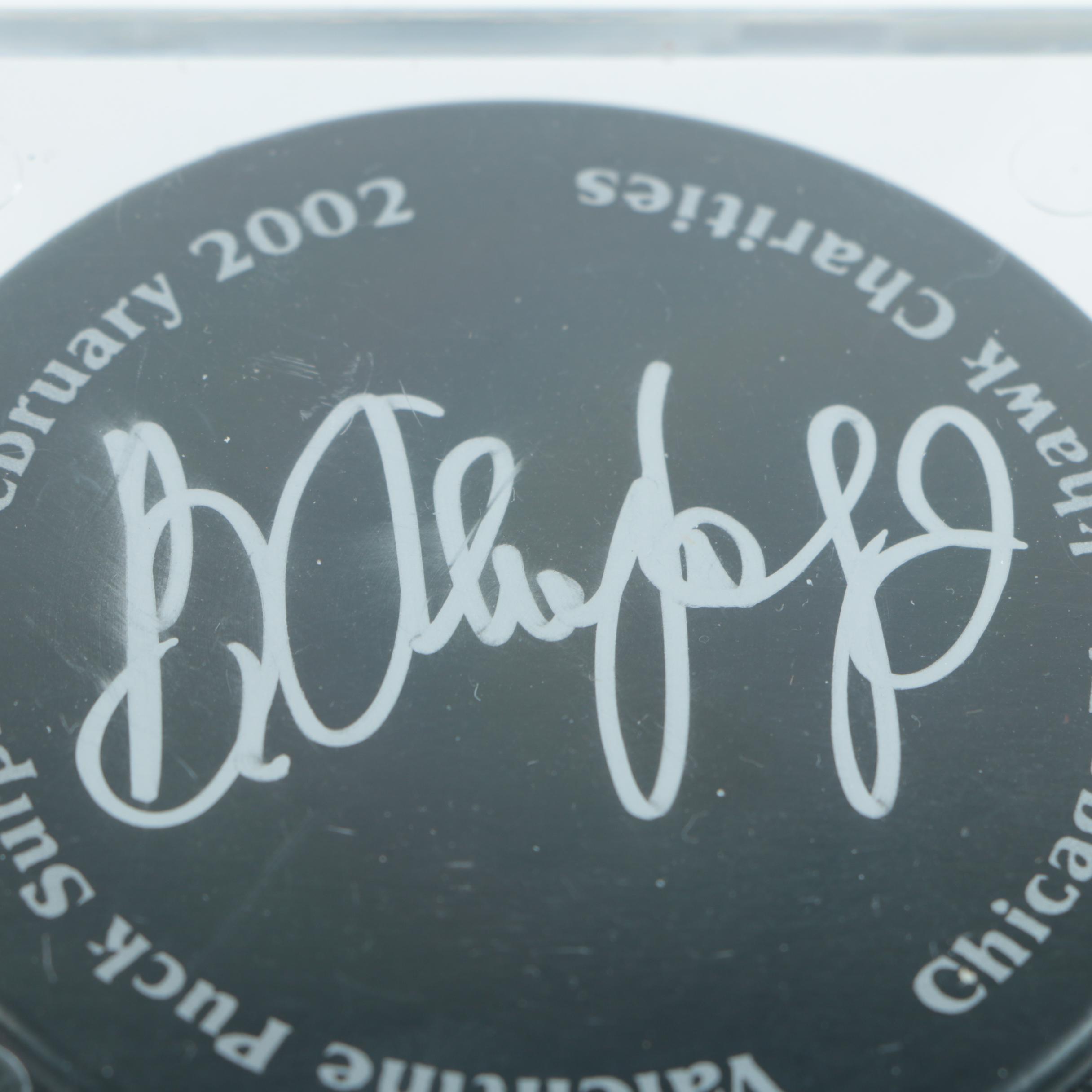 Autographed Chicago Blackhawks Hockey Pucks with 75th Anniversary Puck