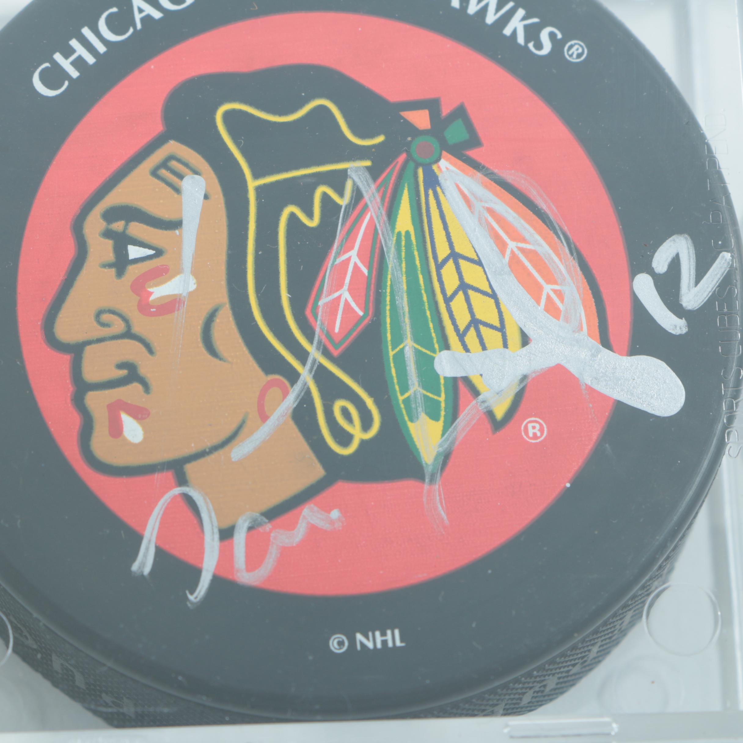 Autographed Chicago Blackhawks Hockey Pucks with 75th Anniversary Puck