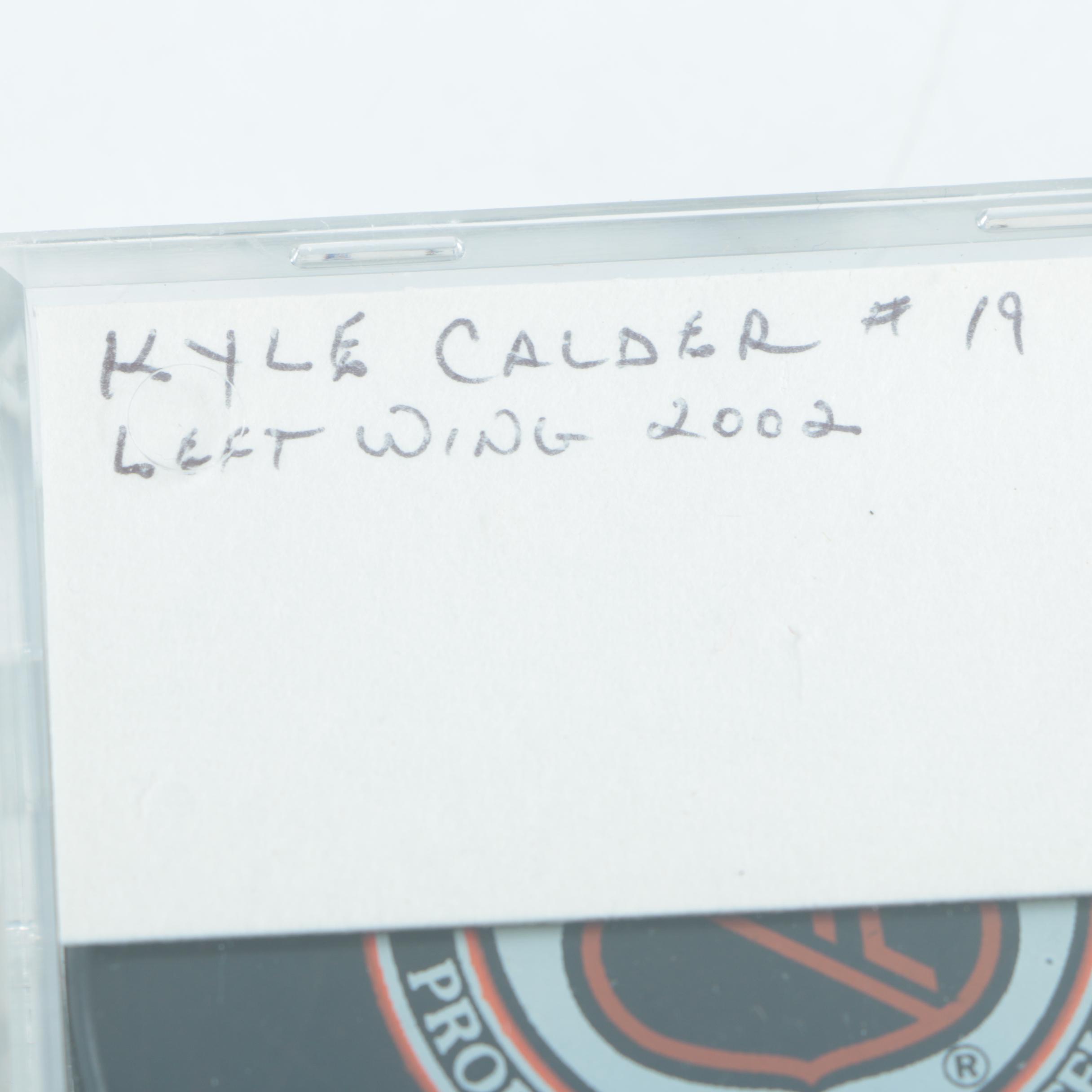 Autographed Chicago Blackhawks Hockey Pucks with 75th Anniversary Puck