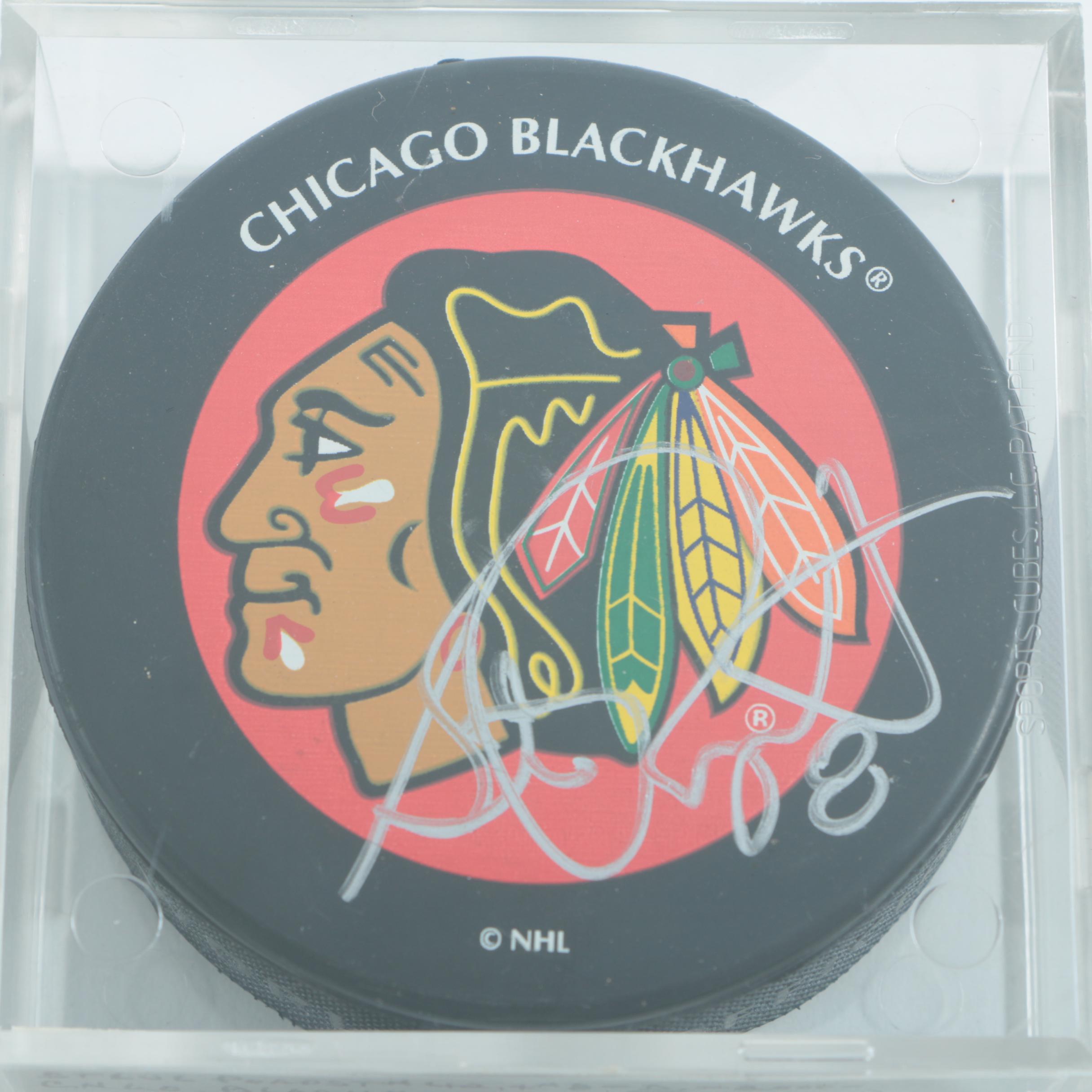 Autographed Chicago Blackhawks Hockey Pucks with 75th Anniversary Puck