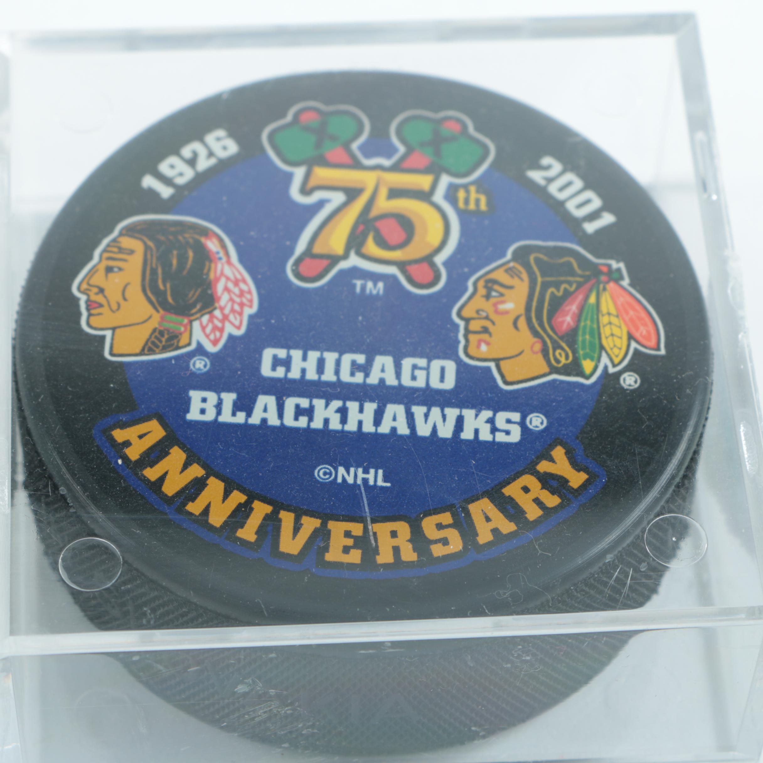 Autographed Chicago Blackhawks Hockey Pucks with 75th Anniversary Puck