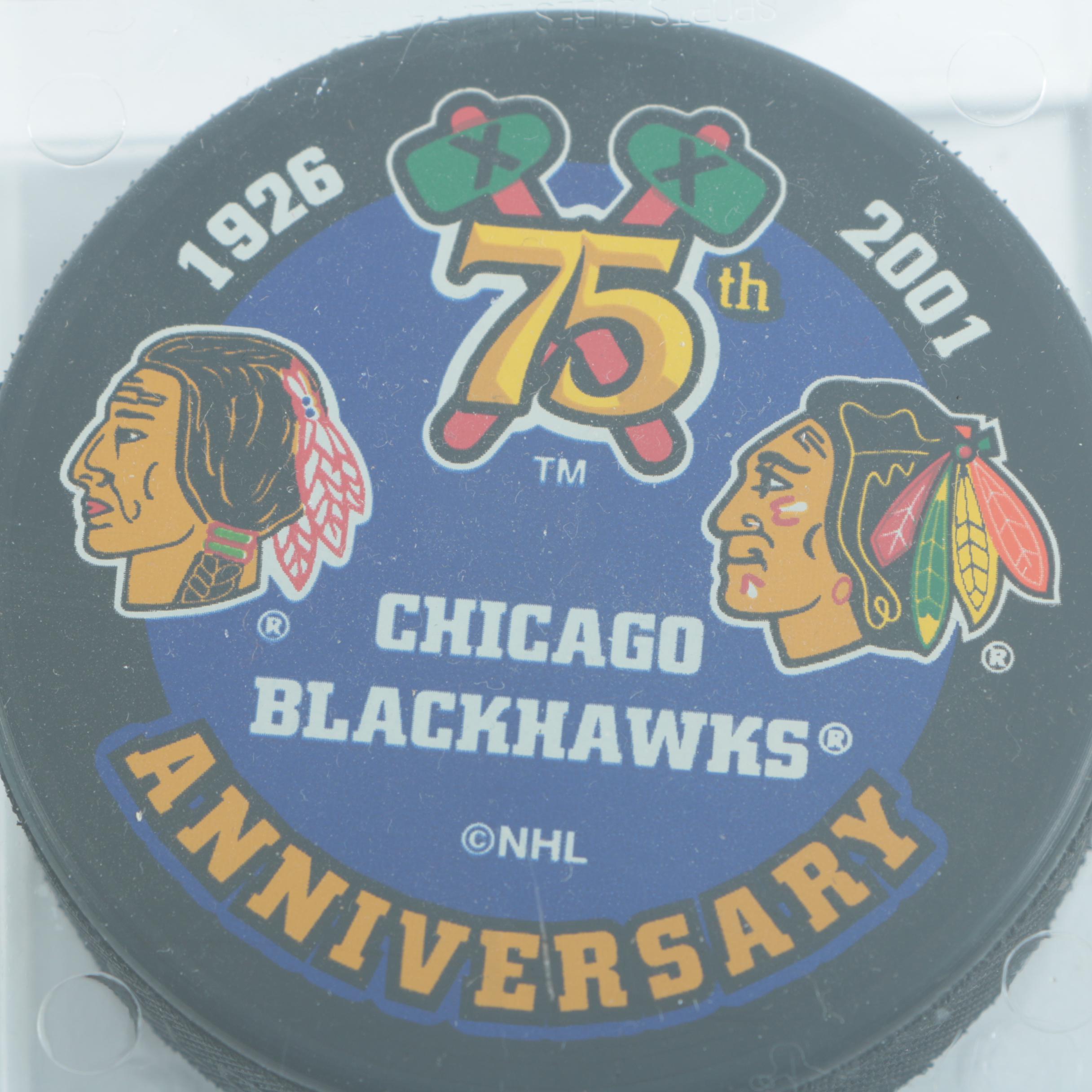 Autographed Chicago Blackhawks Hockey Pucks with 75th Anniversary Puck