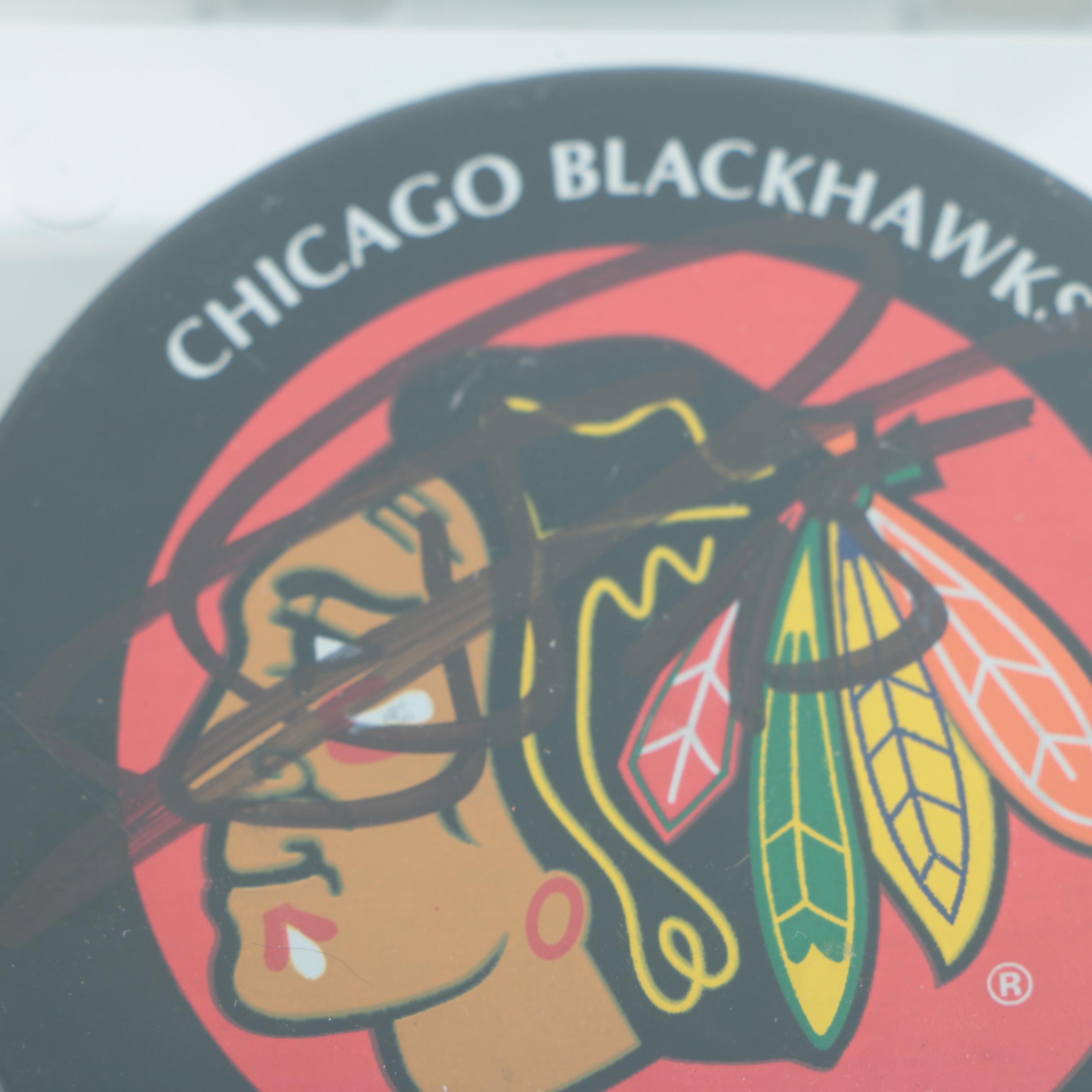 Autographed Chicago Blackhawks Hockey Pucks with 75th Anniversary Puck