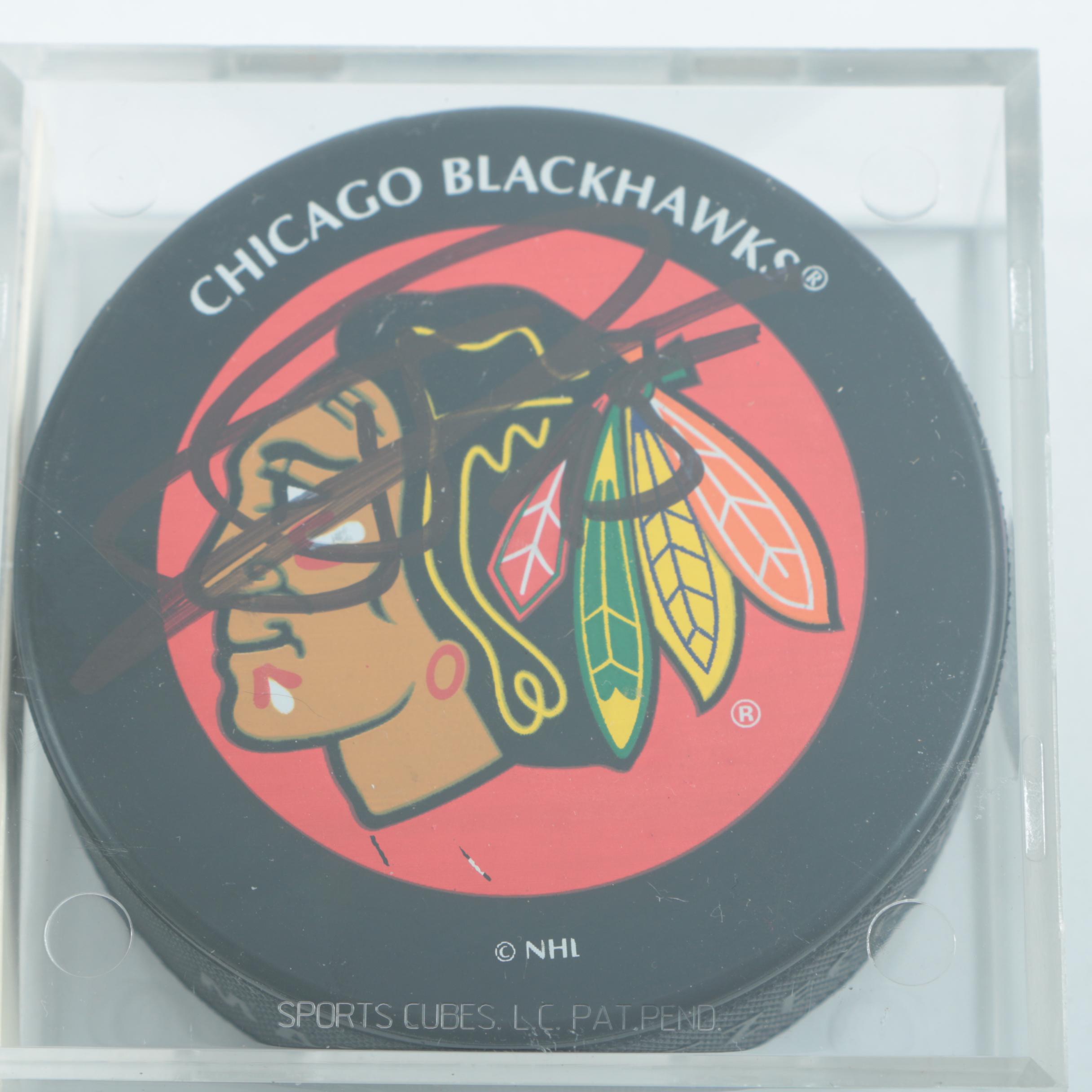 Autographed Chicago Blackhawks Hockey Pucks with 75th Anniversary Puck