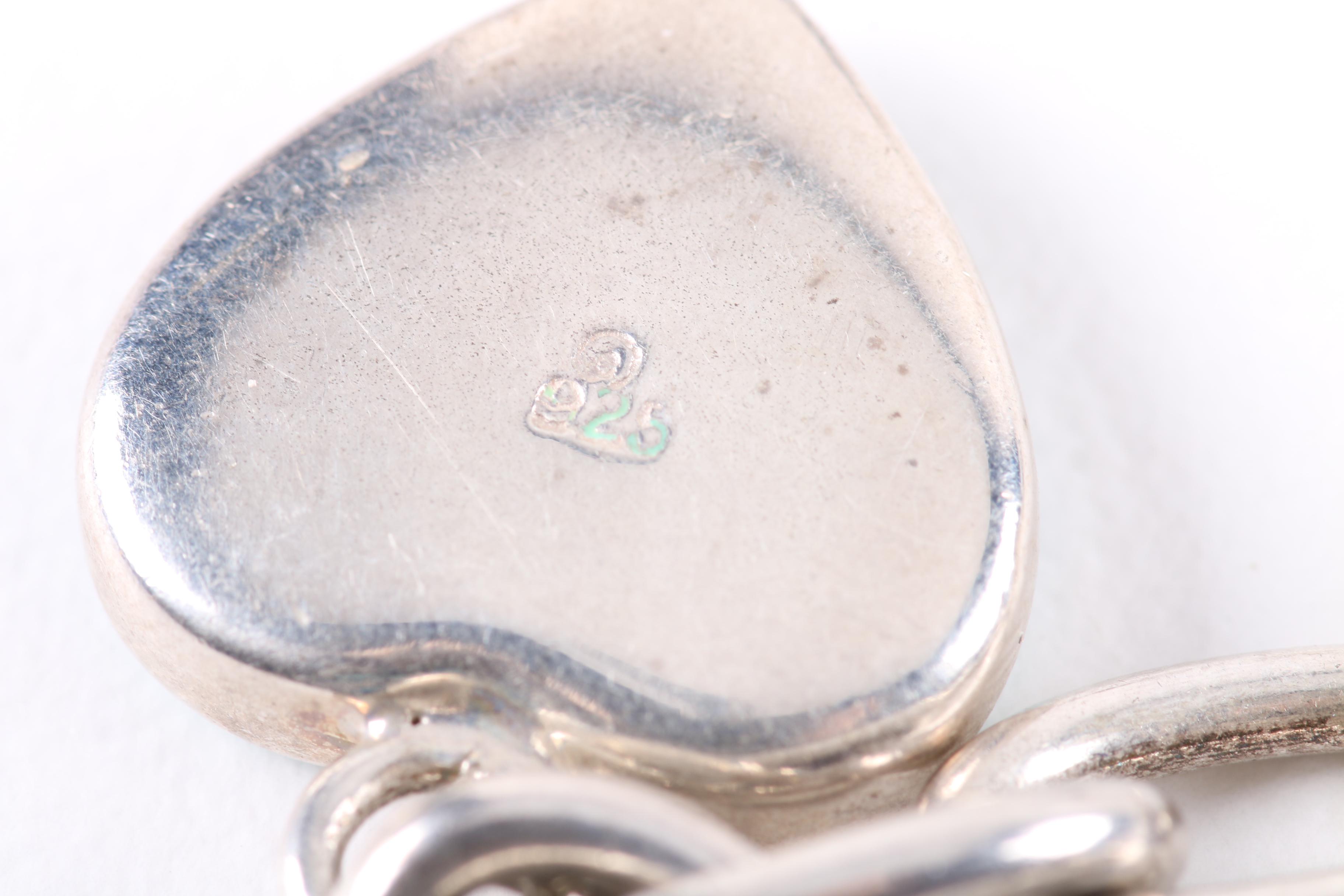 Two Sterling Silver Bracelets Featuring Shell and Imitation Stone