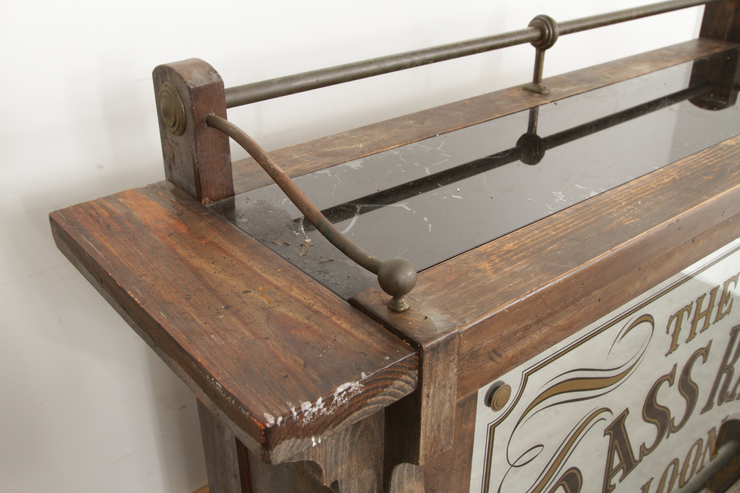 Antique-Style Wood Bar with Saloon Sign