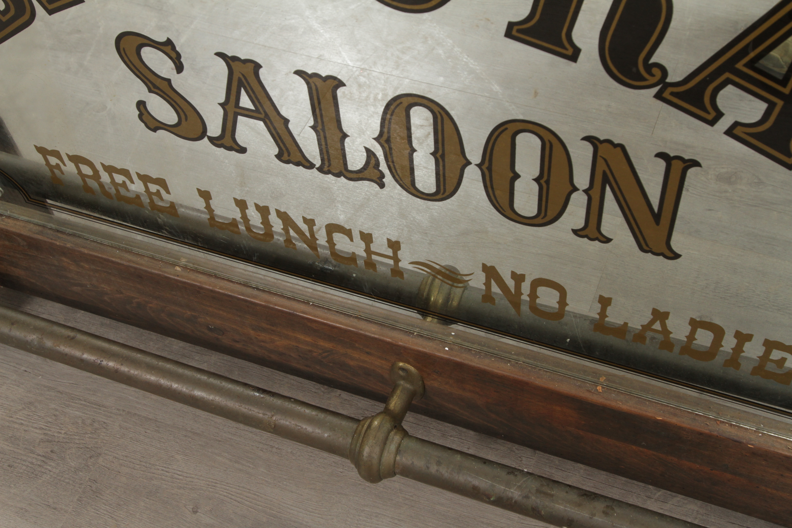 Antique-Style Wood Bar with Saloon Sign
