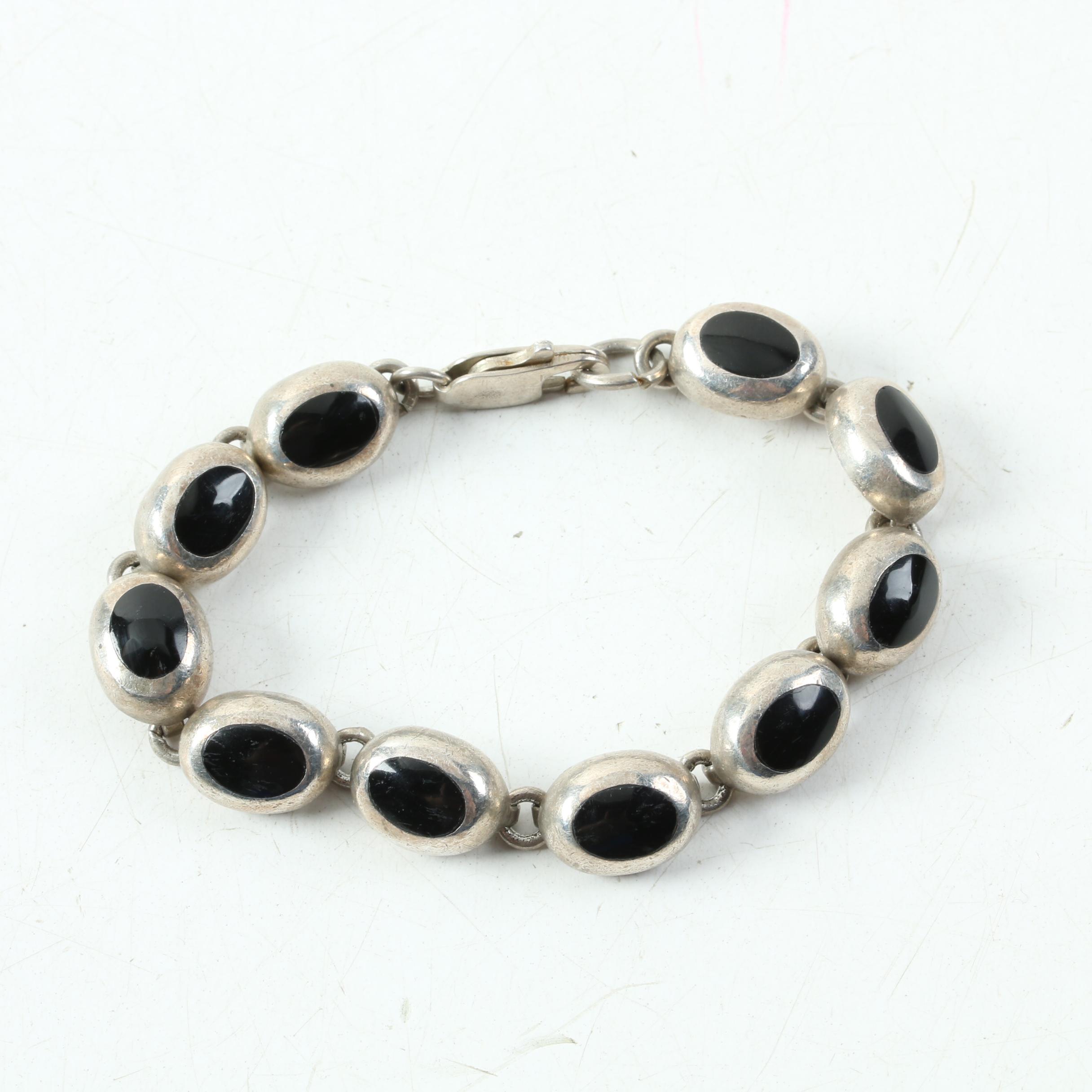 Assortment of Sterling Silver Jewelry Including Onyx, Mother of Pearl, and Opal