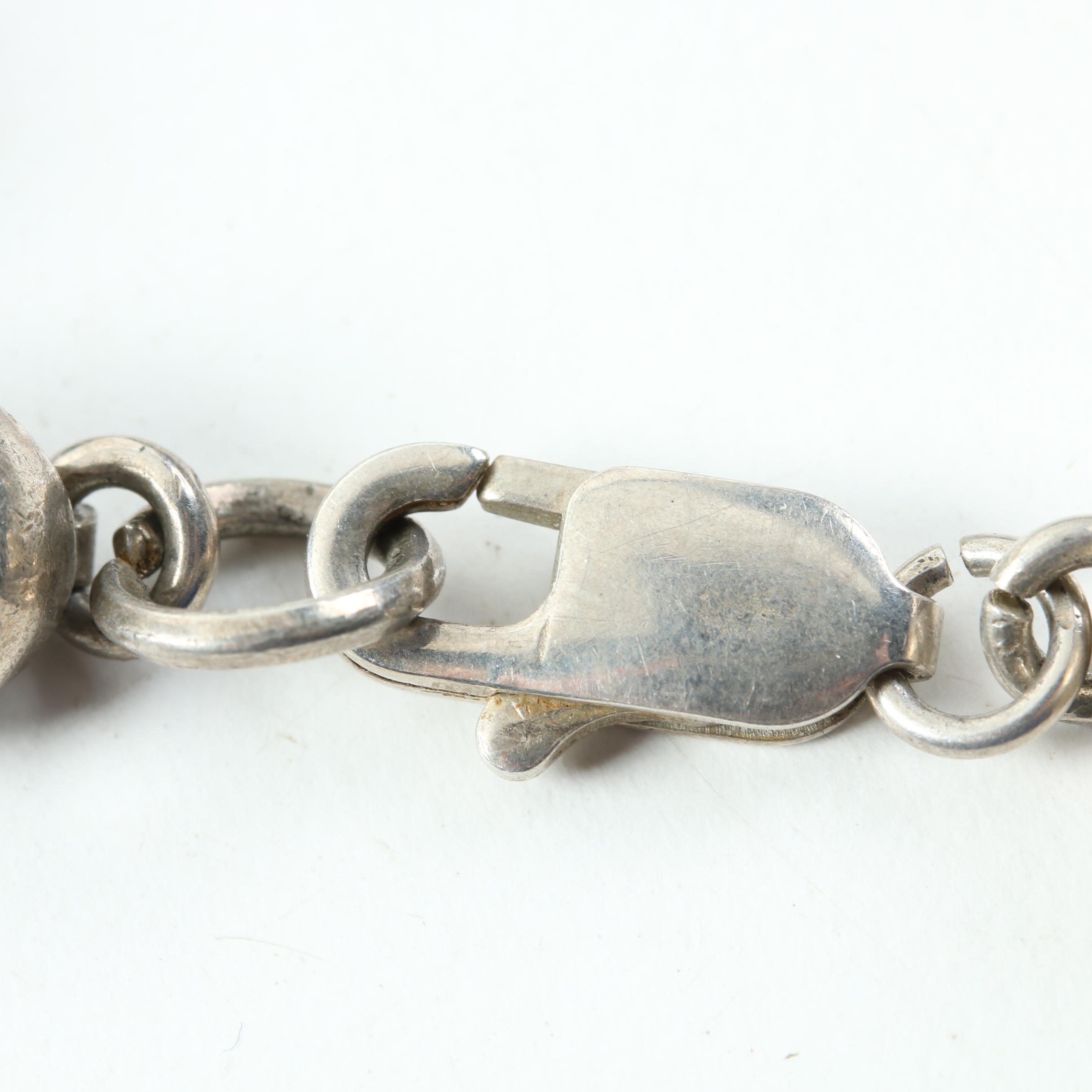 Assortment of Sterling Silver Jewelry Including Onyx, Mother of Pearl, and Opal