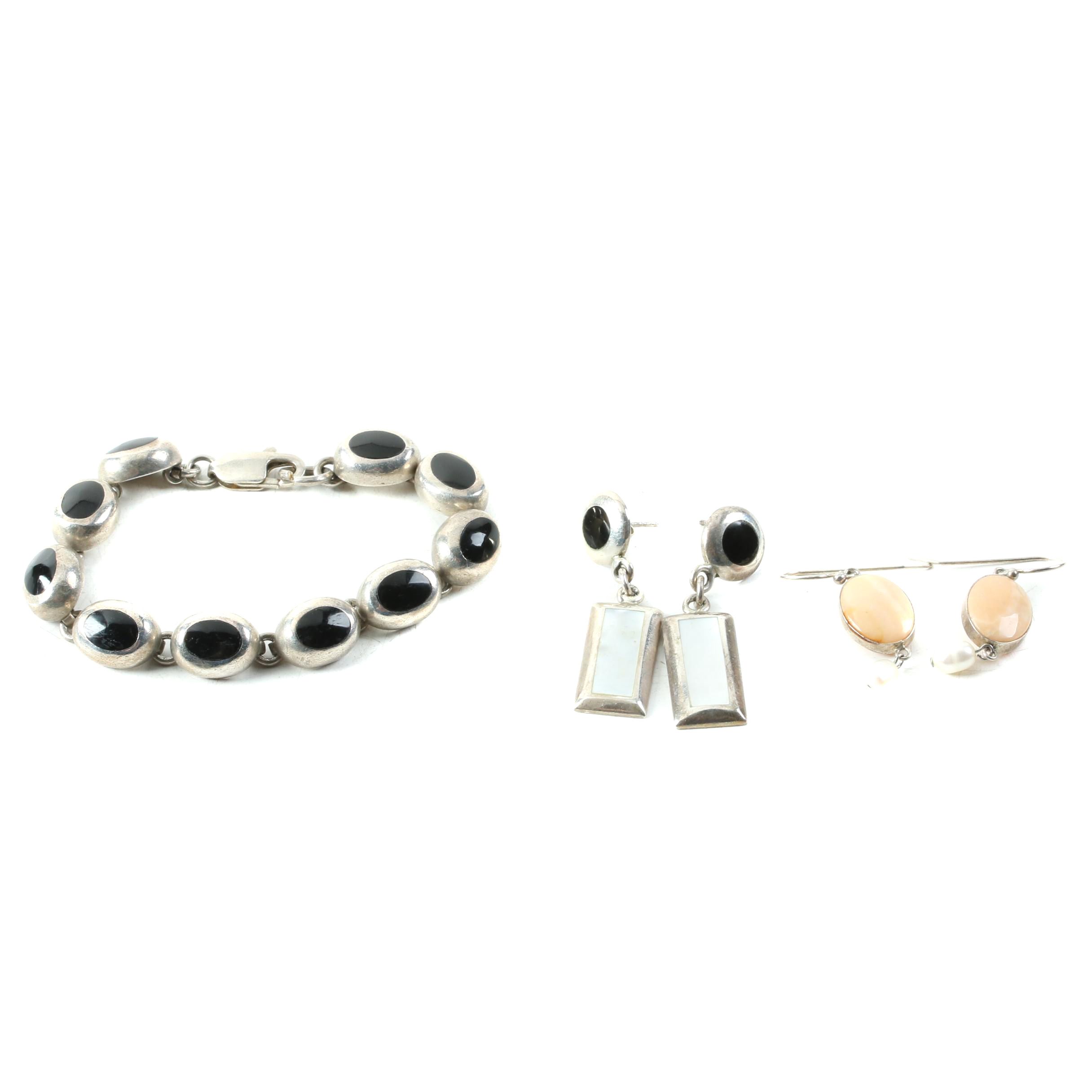 Assortment of Sterling Silver Jewelry Including Onyx, Mother of Pearl, and Opal