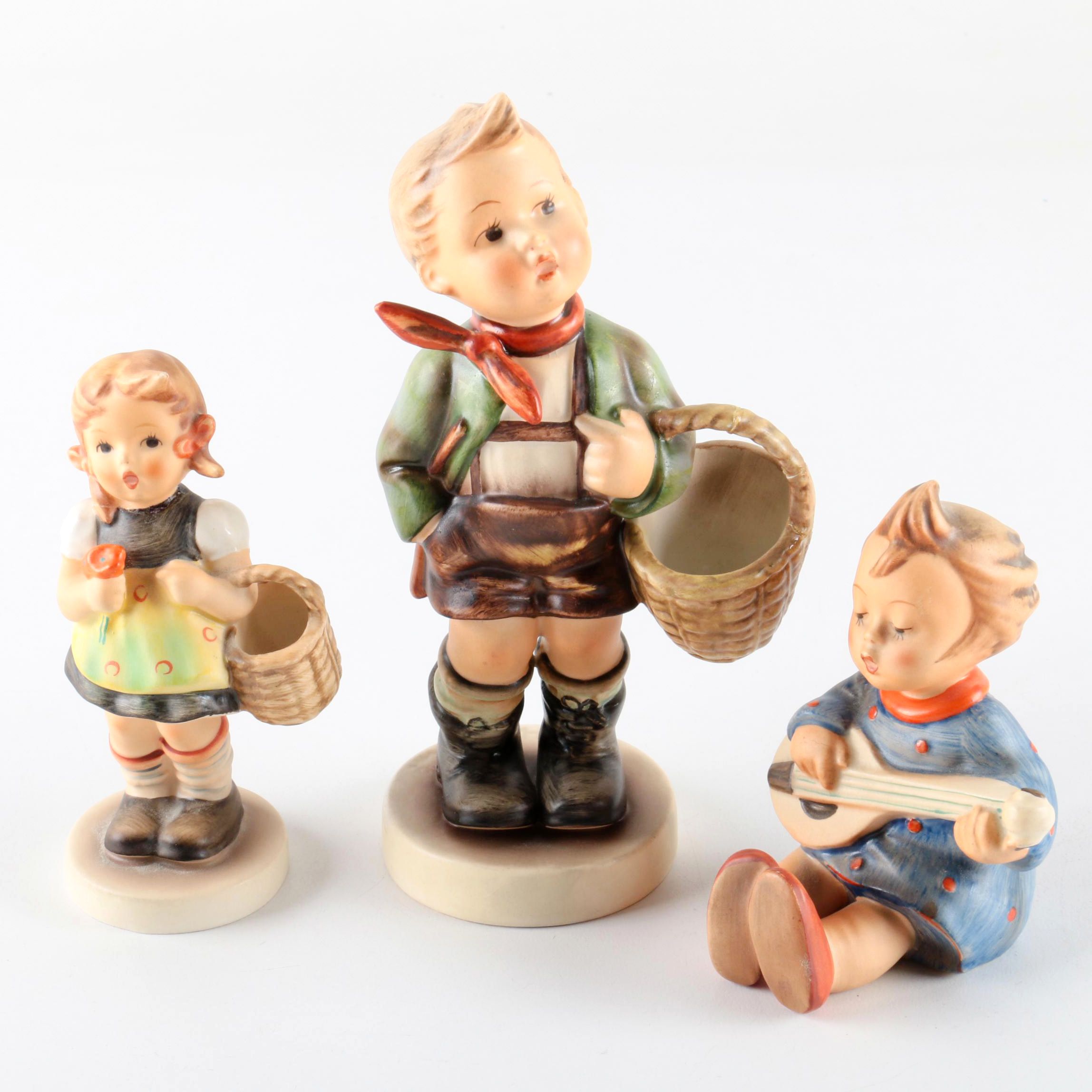 Hummel "Village Boy", "Sister", and "Banjo Player" Figurines