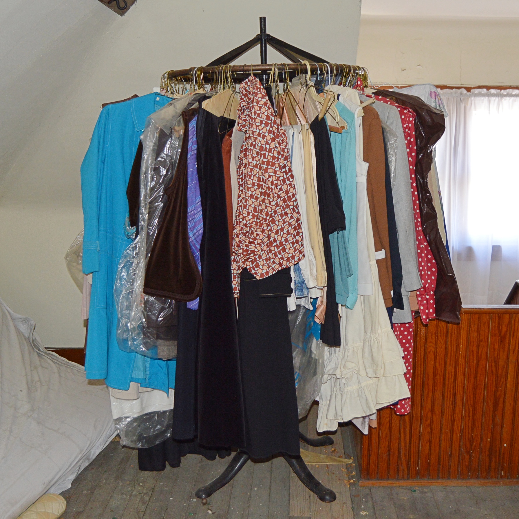 Vintage Iron Revolving Clothing Rack with Vintage Clothes Collection